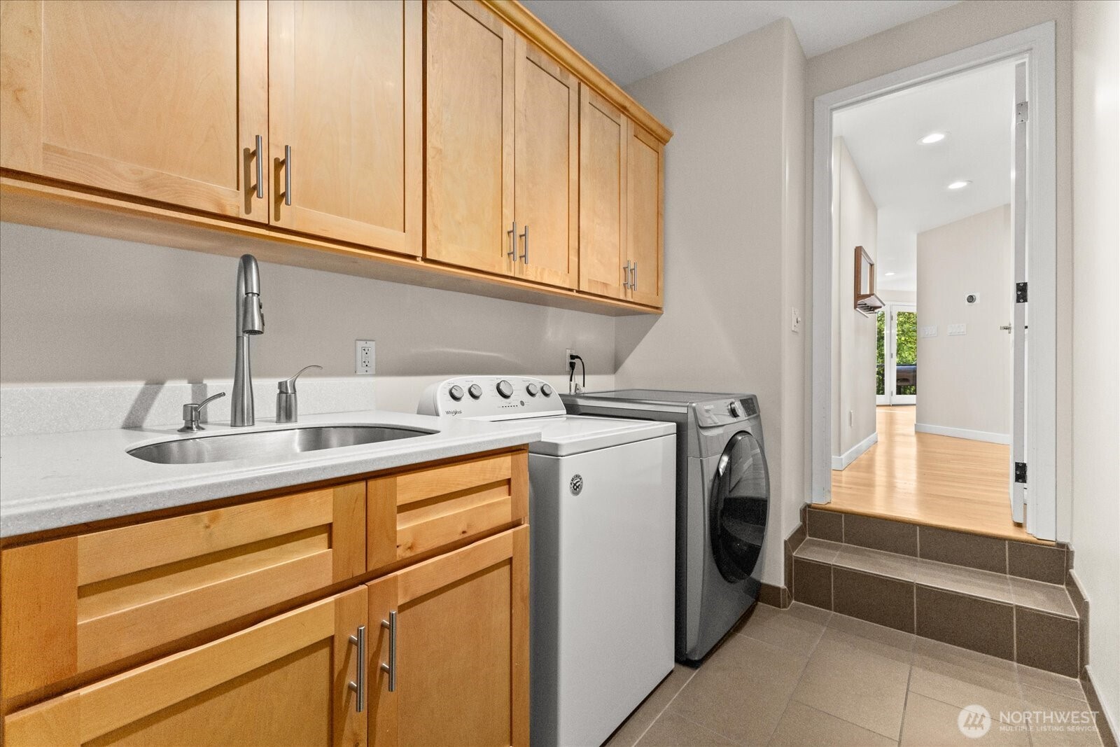 Stylish main-floor 3/4 bath with convenient dual access