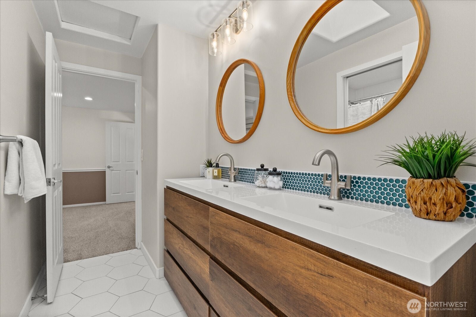 One of two spacious upper-level bedrooms with convenient Jack-and-Jill bath. Virtually staged for inspiration