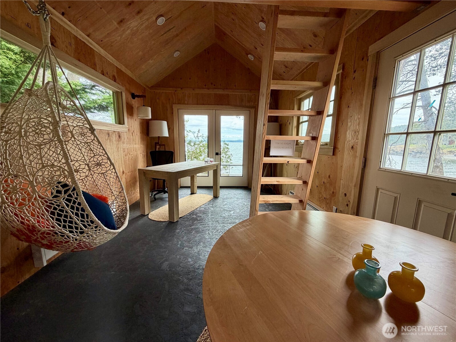 Boat house makes a great office, yoga studio, guest house with sleeping and storage loft. Has a connected composting toilet and is ready for outdoor shower installation.