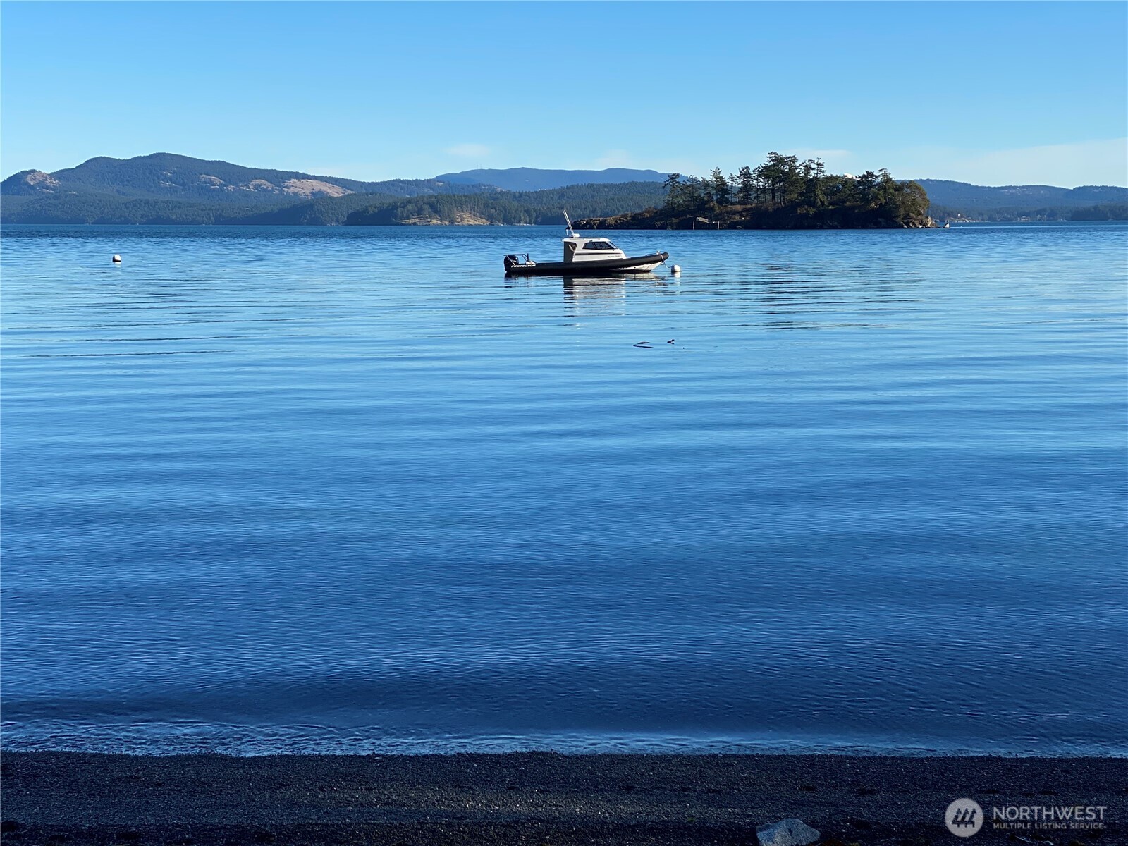 An annually inspected, permitted mooring buoy sits just offshore in approximately 50 feet of water, offering convenient access to the bay and surrounding San Juan Islands, including Jones Island Marine State Park.