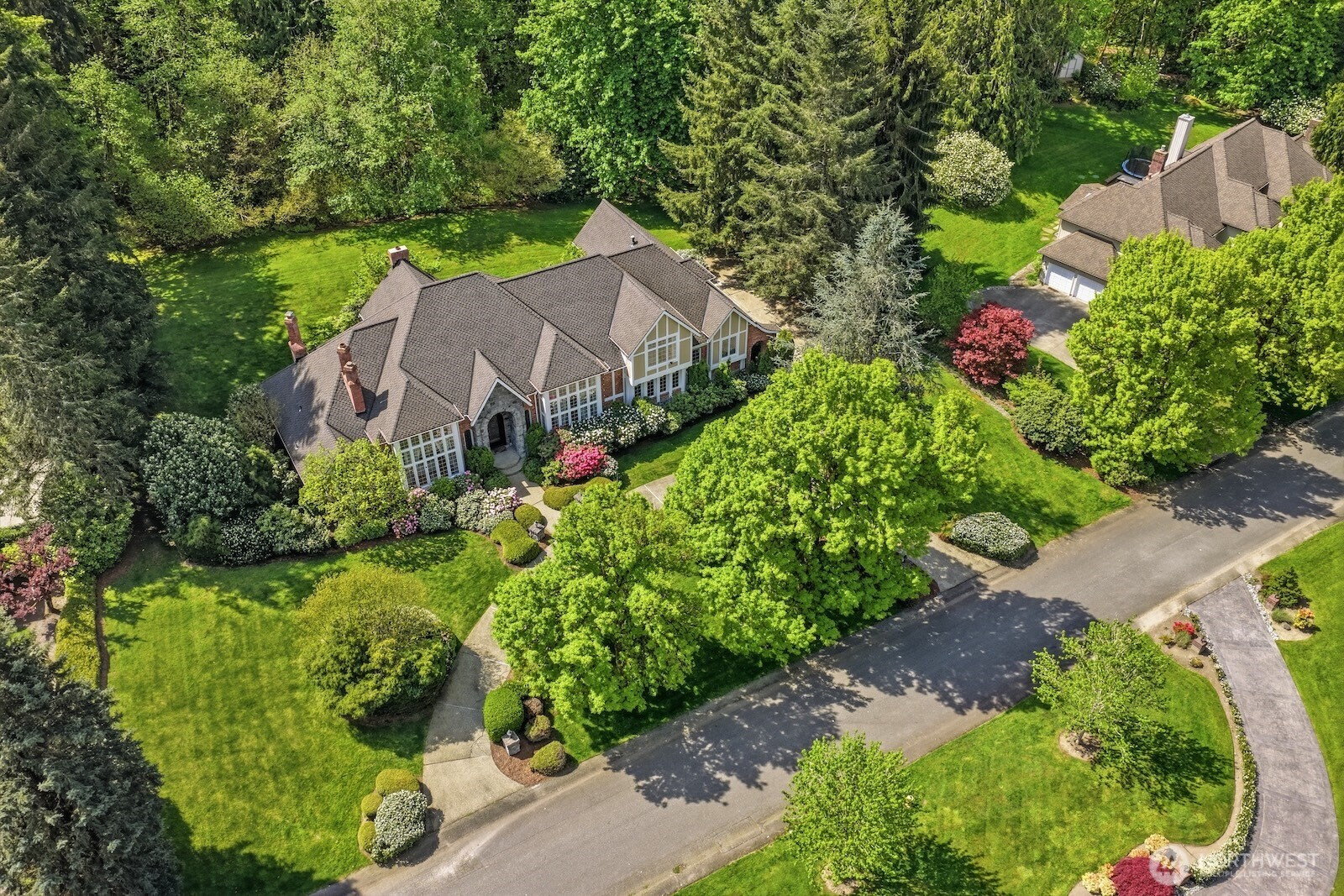 Set along a prestigious, mansion-lined street, this regal 5* bedrooms, 4.5-bath residence rests on meticulously manicured shy-acre grounds, offering both privacy and grandeur.