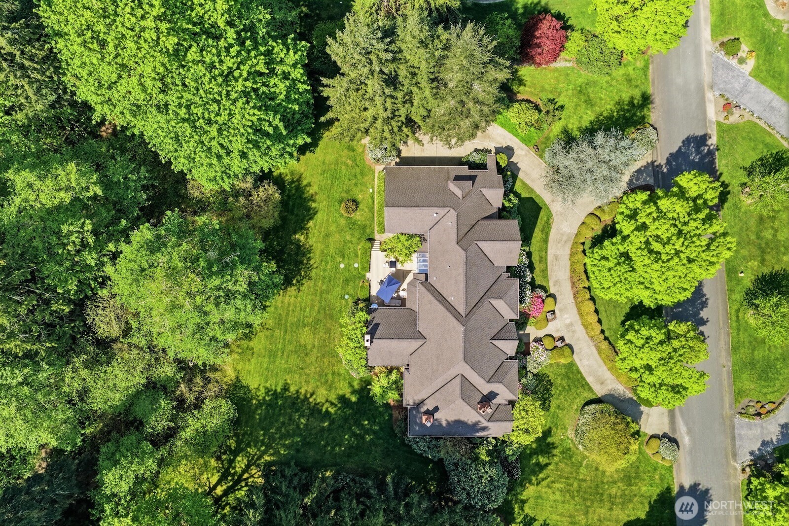 A stately circular drive and commanding curb appeal set the tone for what awaits within.