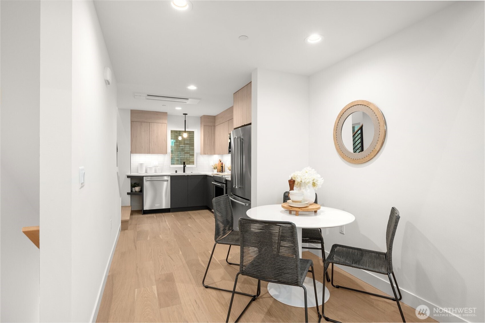 Dedicated dining area perfectly positioned between the kitchen and living room.