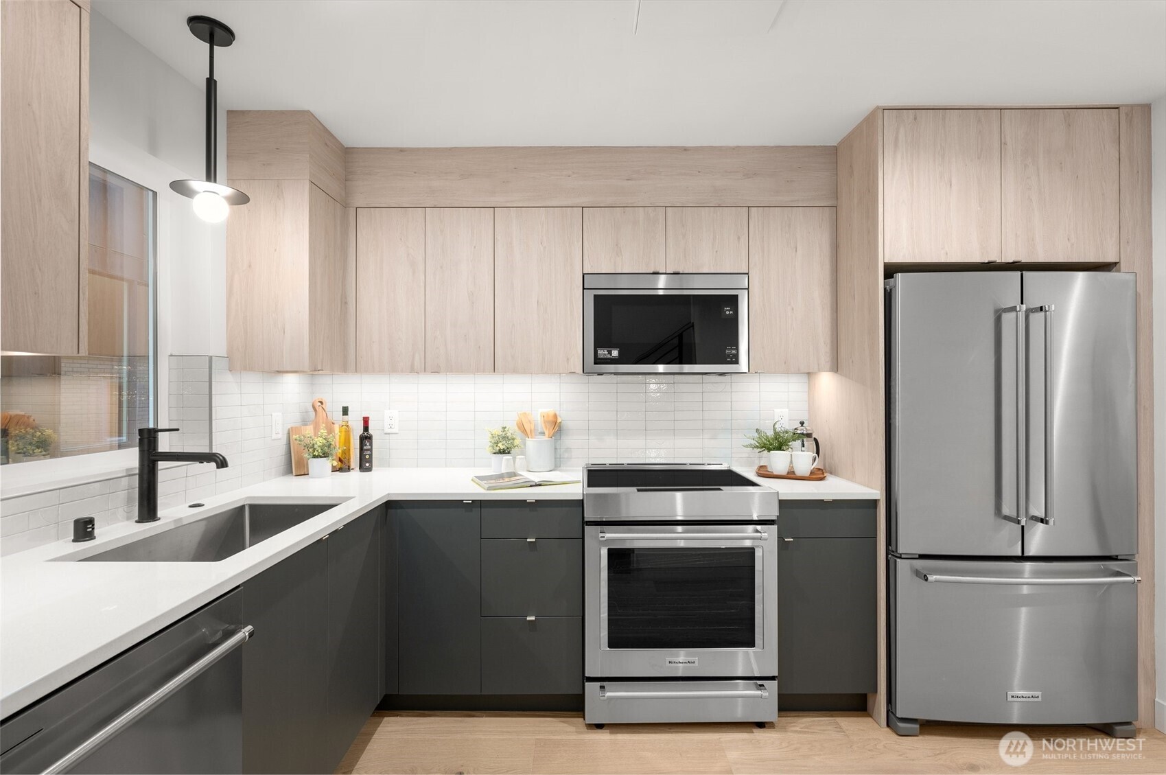 : Modern cabinetry and designer hardware provide ample storage and high-end style.