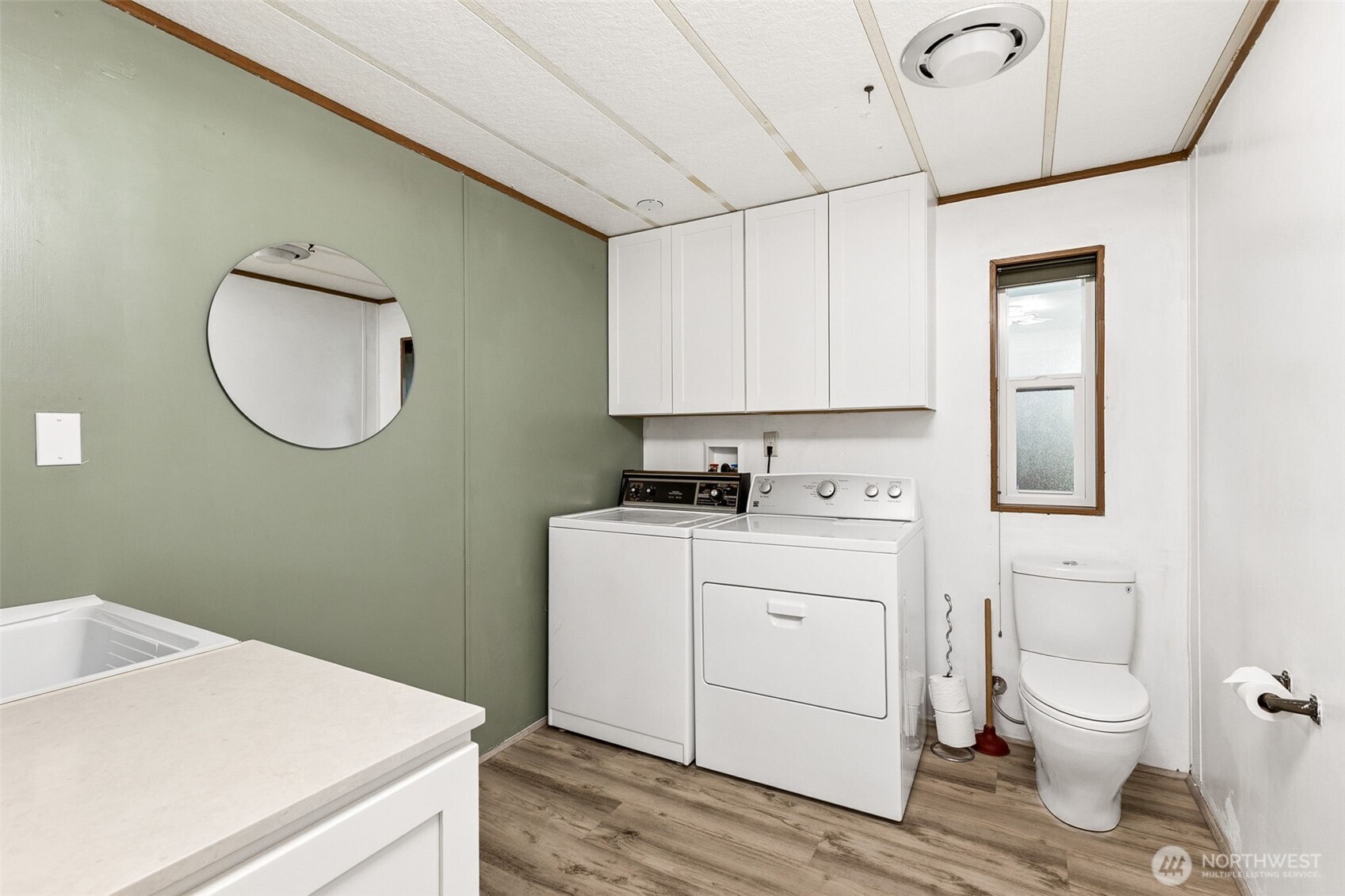Oversized laundry room and 1/2 bath