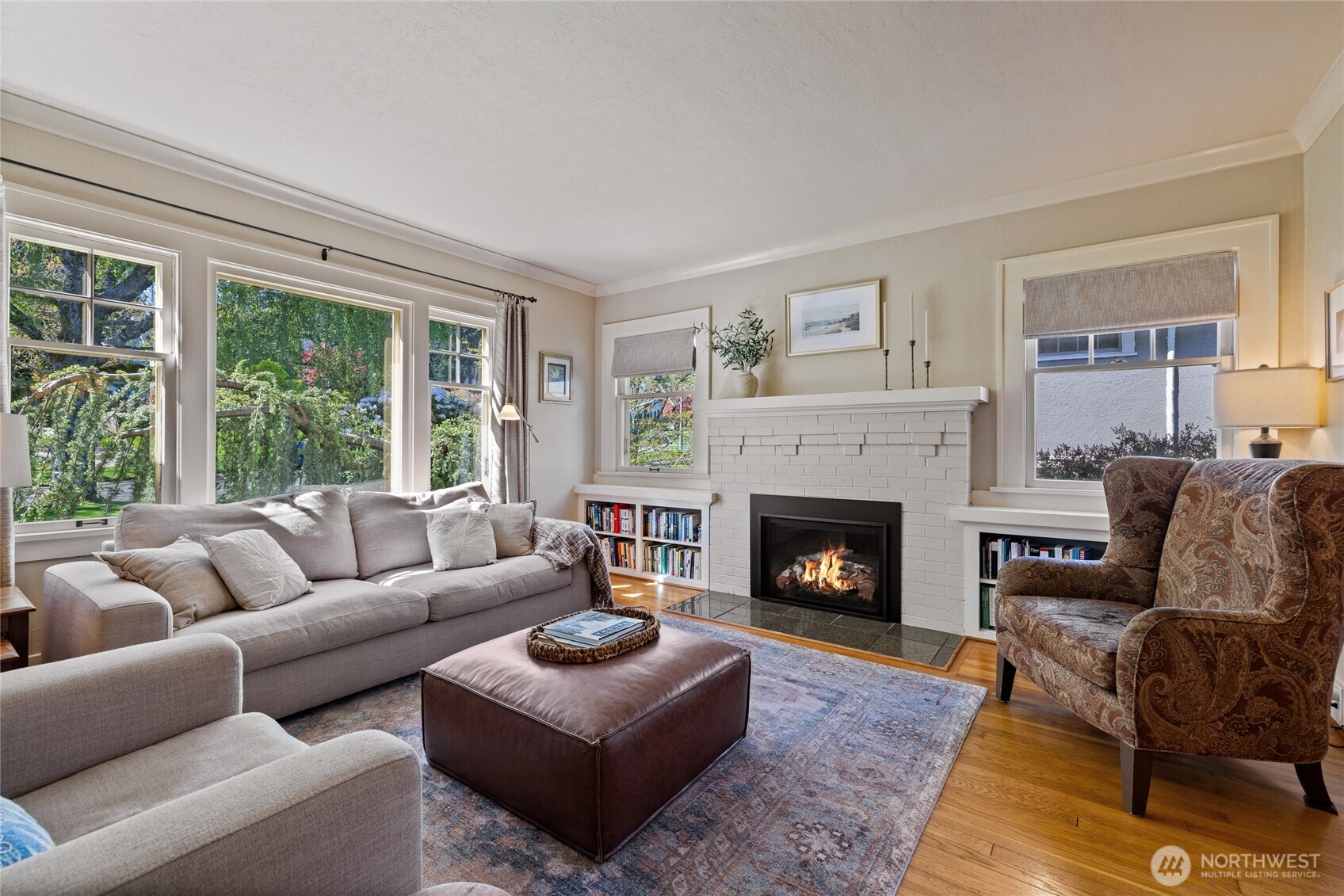 Large windows out front keep the room bright all year.