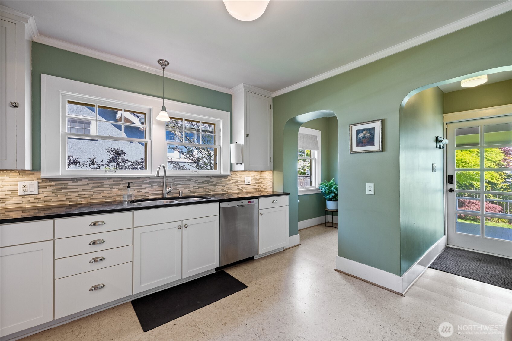 Glass paned door to the backyard & covered deck.  Cute breakfast nook on the left.