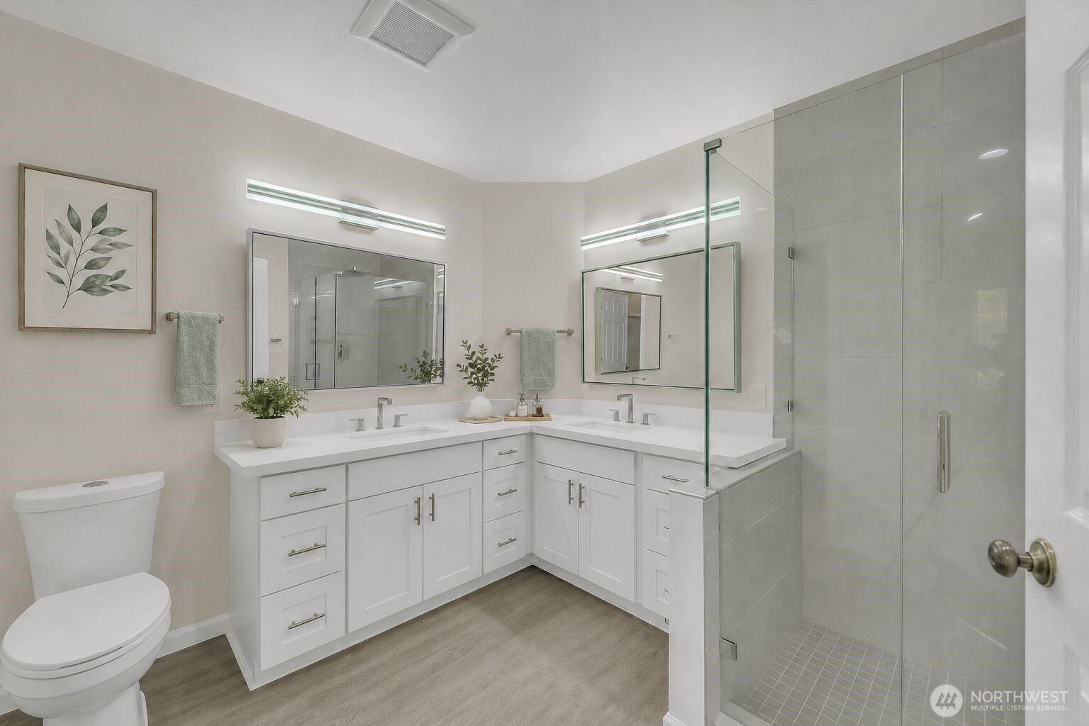 Beautifully updated  Primary Bath with quartz counters.