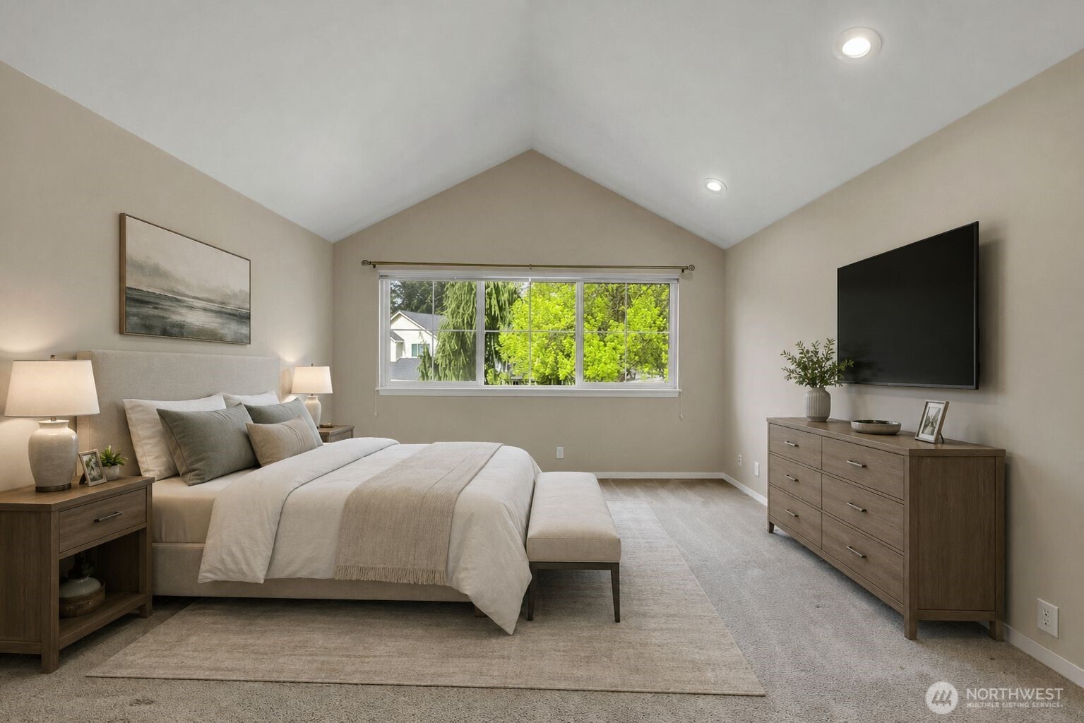 Primary Bedroom. Vaulted ceiling. Large window