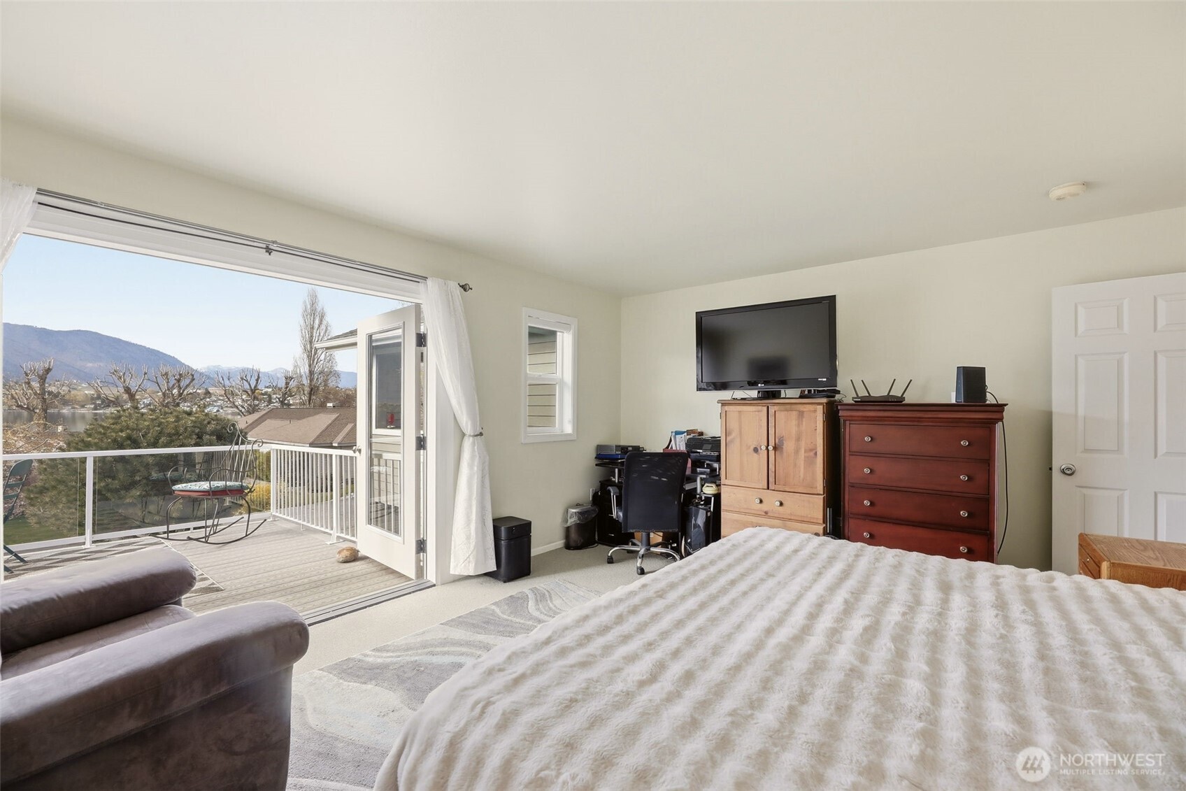 French doors that lead to your owner suite balcony