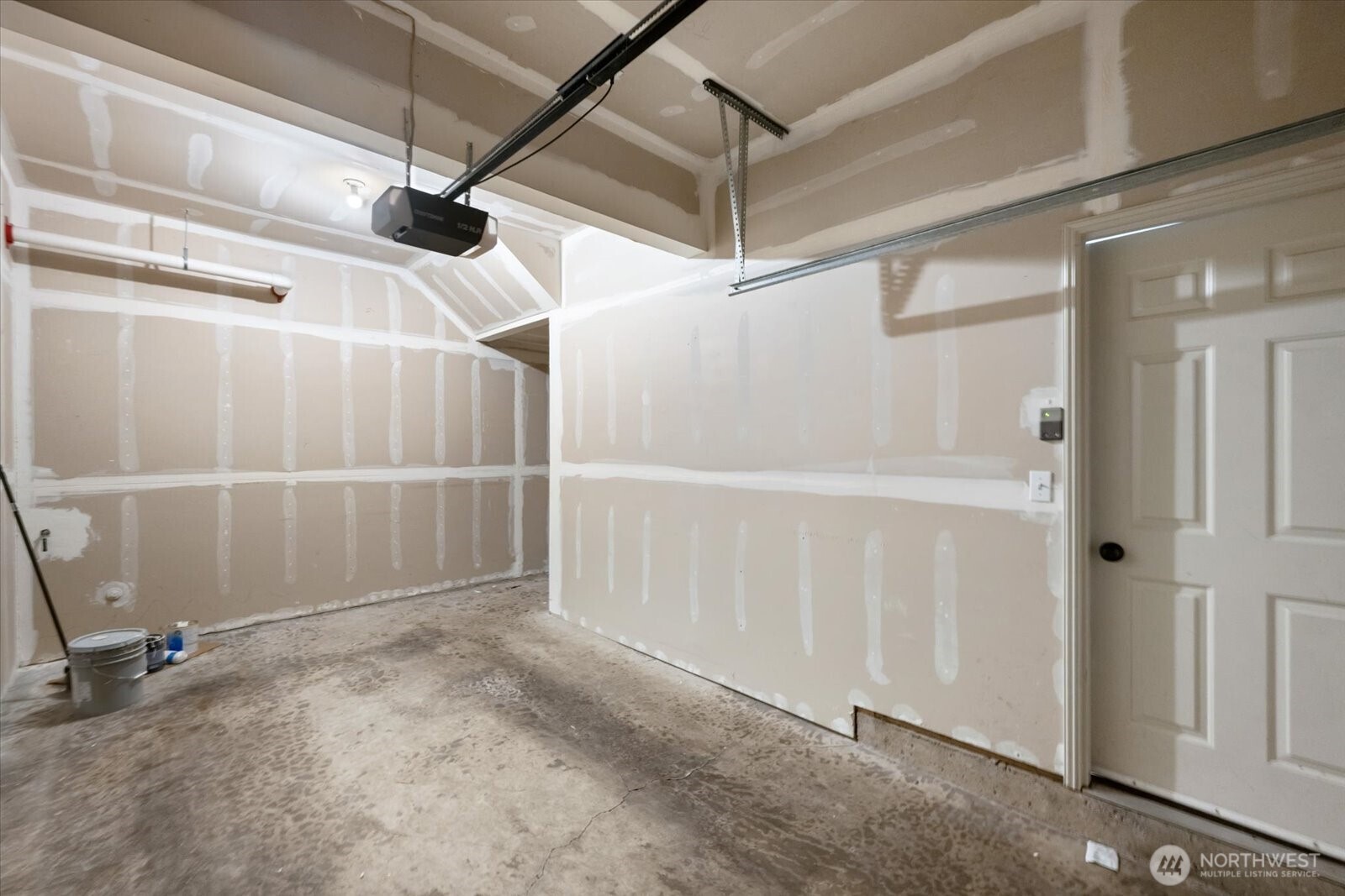 This one car garage has additional storage space on the far right.