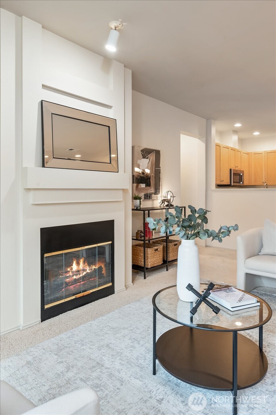 The fireplace makes this a cozy nook, with space to display a gorgeous artwork.
