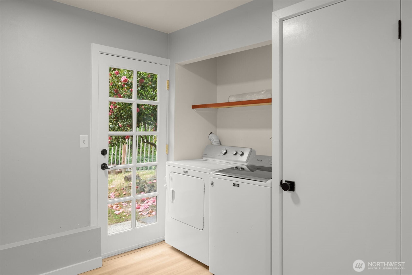 Utility room with access to patio