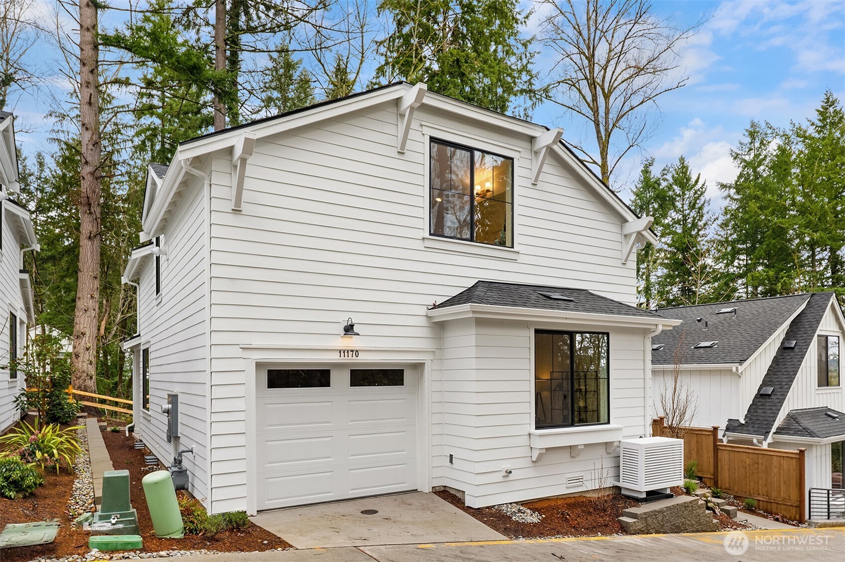 Welcoming covered patio with greenbelt views