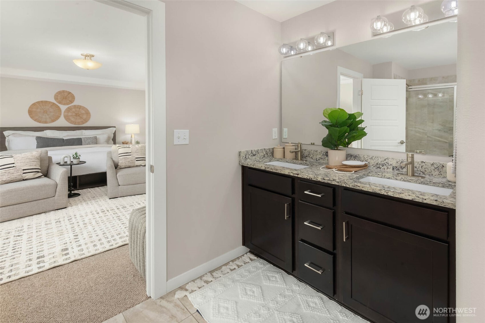 Primary bath with dual vanities, soaking tub and large walk-in closet.