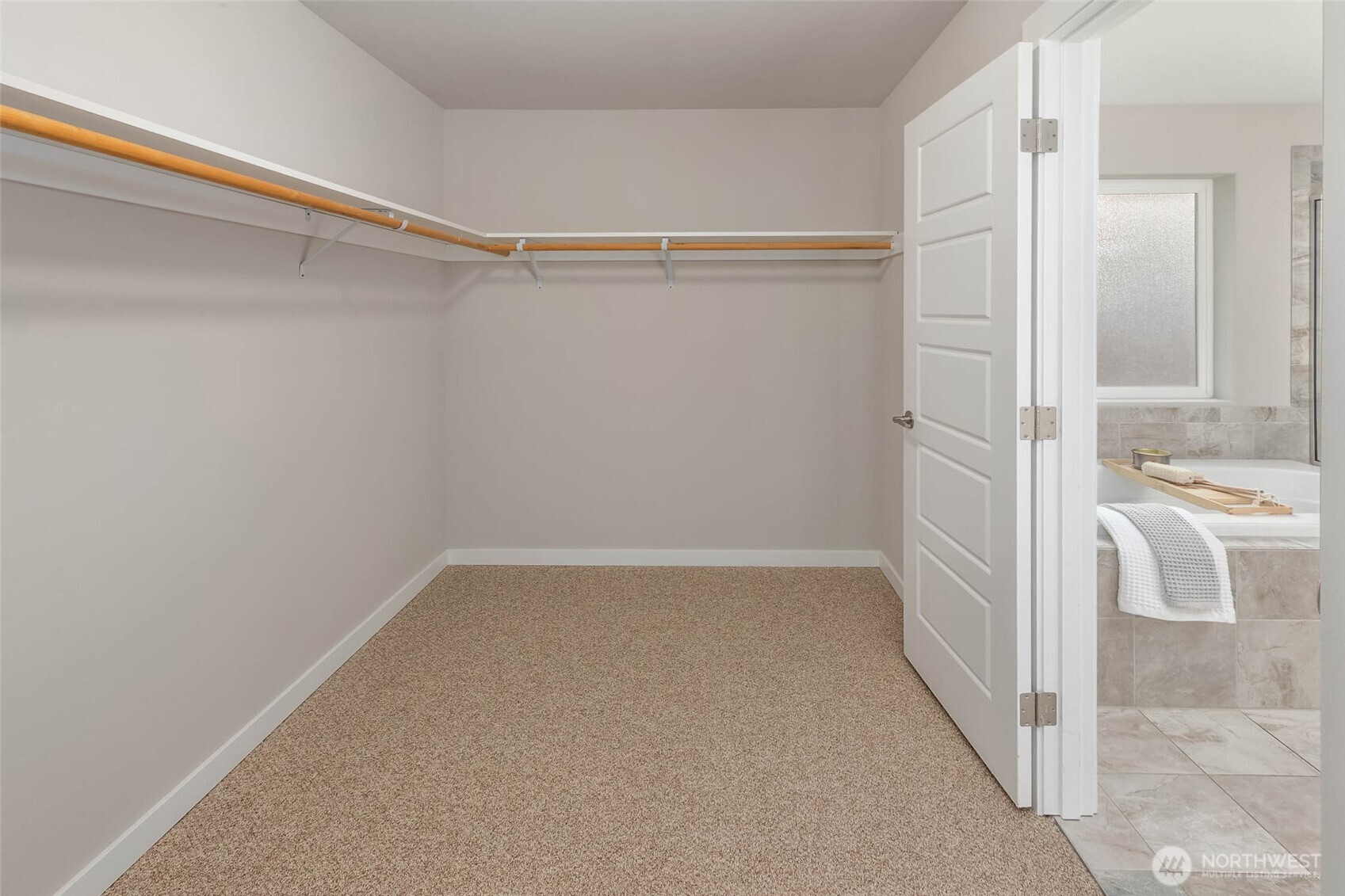 Primary walk-in closet.