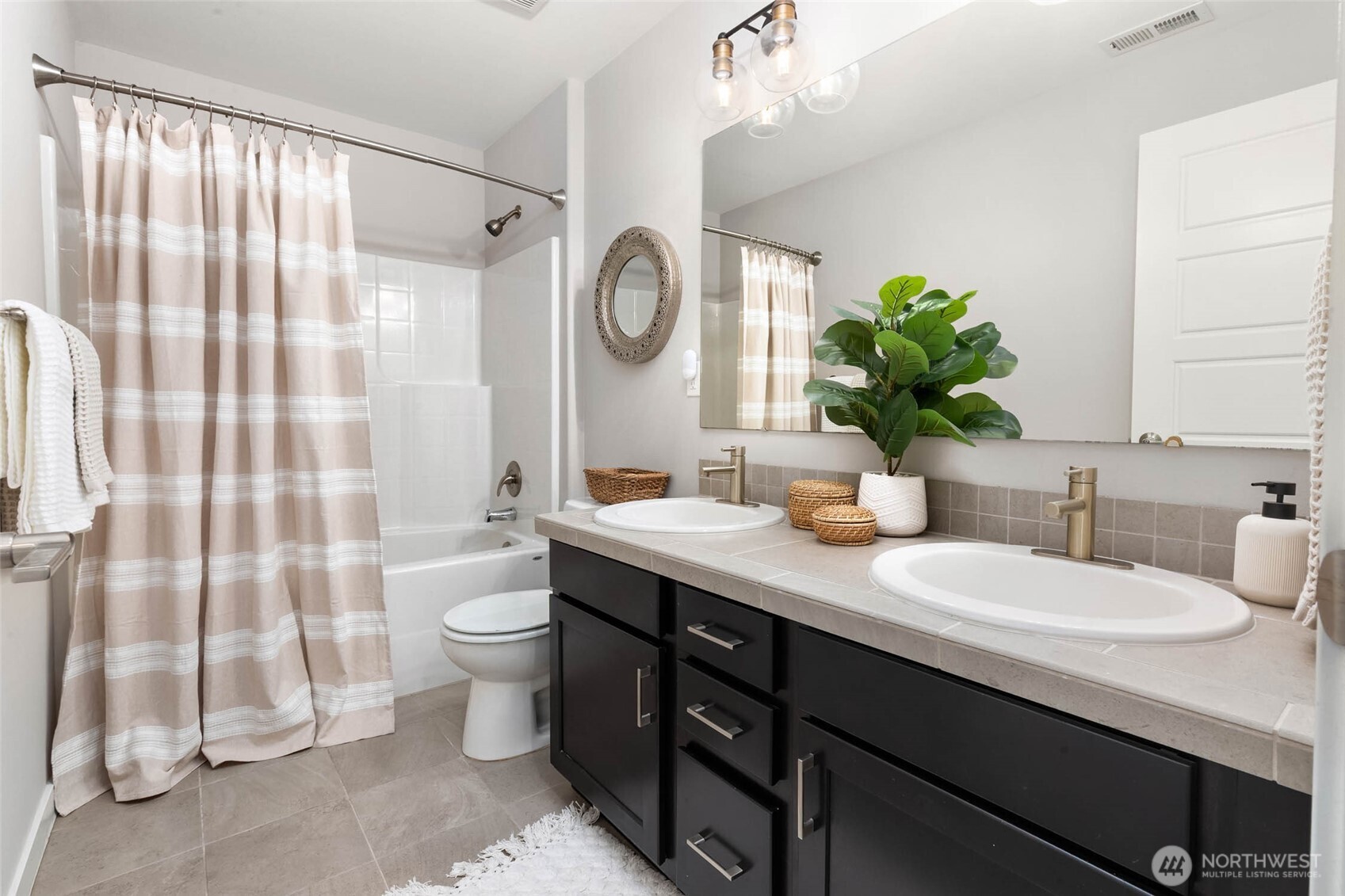 Full hallway bathroom on upper level.