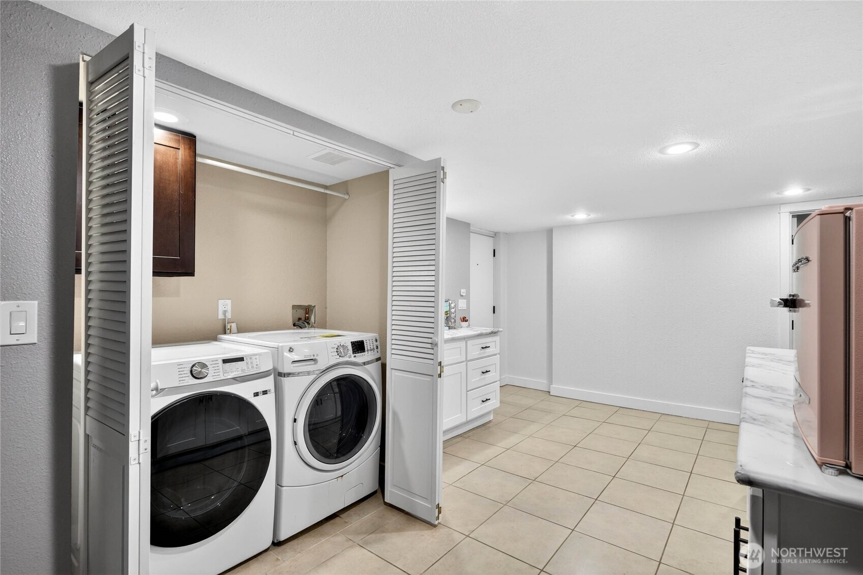Washer & Dryer located in lower level closet