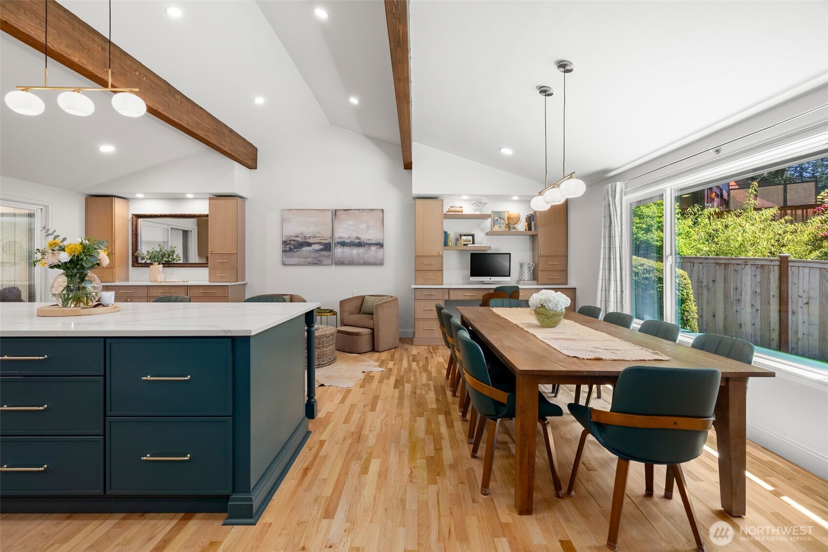 The ceilngs are vaulted in this kitchen and living space. This is the heart of the home.