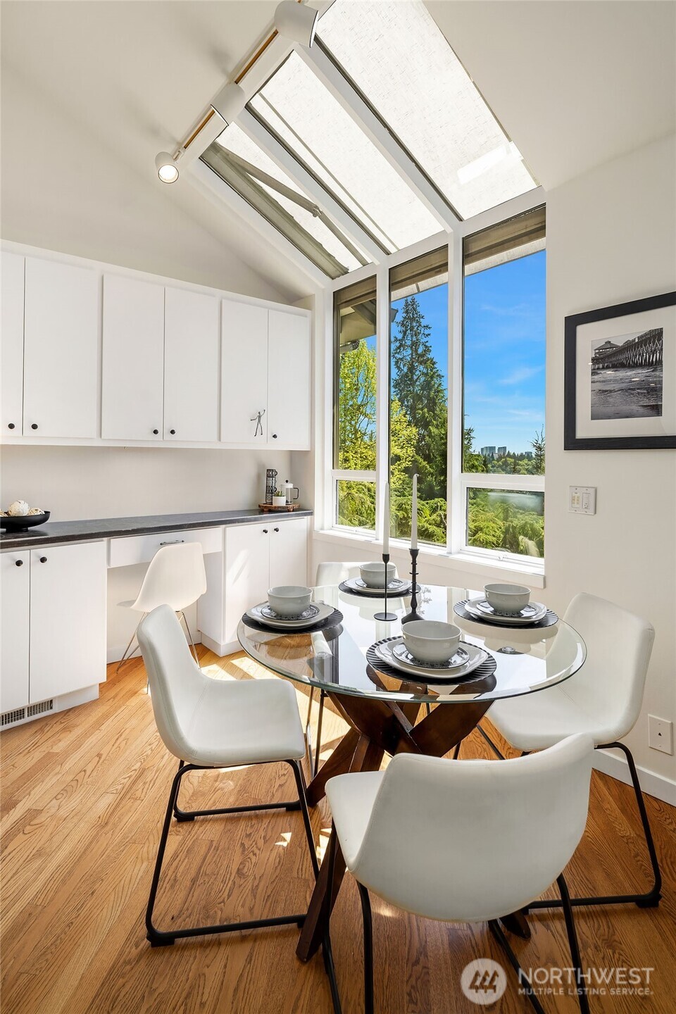 Casual eating space with built-in buffet and sunlit windows