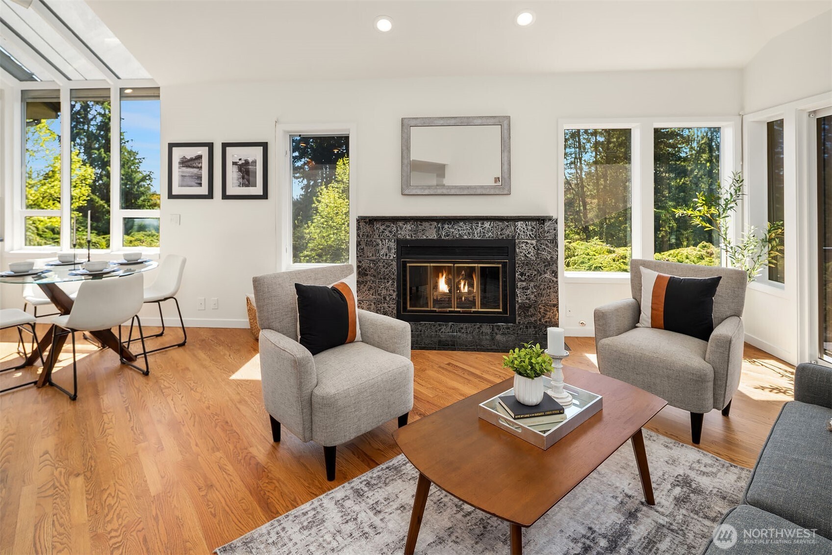 Light-filled family room offers gas fireplace and opens to outdoor deck
