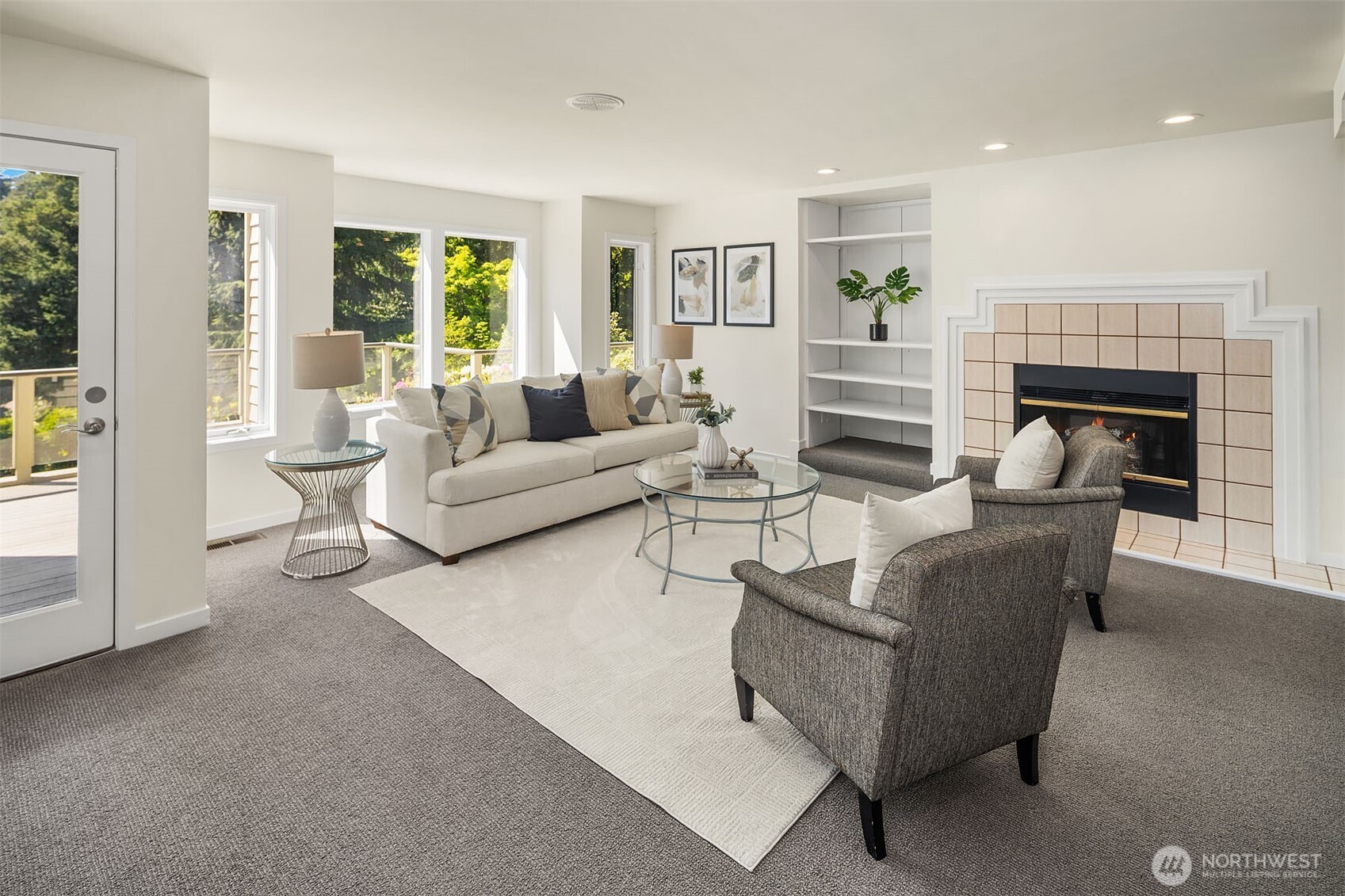 Light-filled rec room with gas fireplace and access to deck and the outdoors