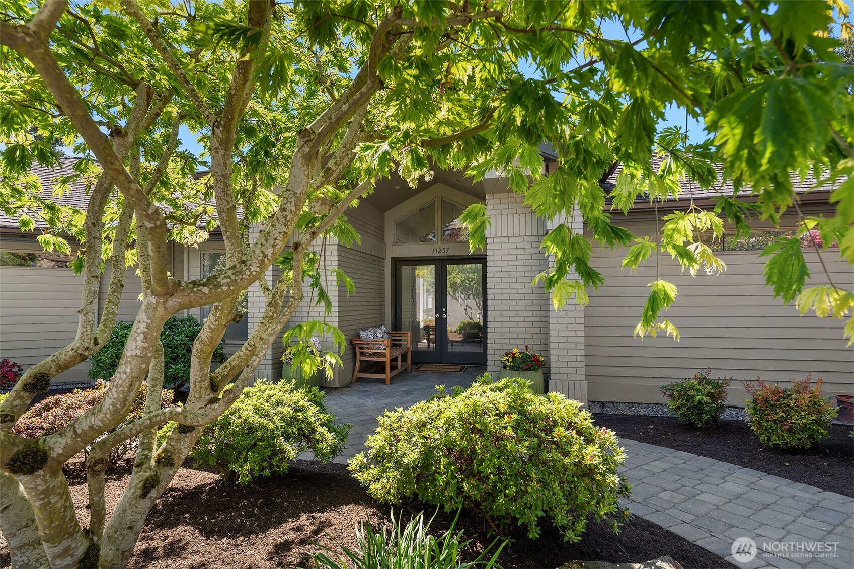 Home is framed by beautiful landscaping