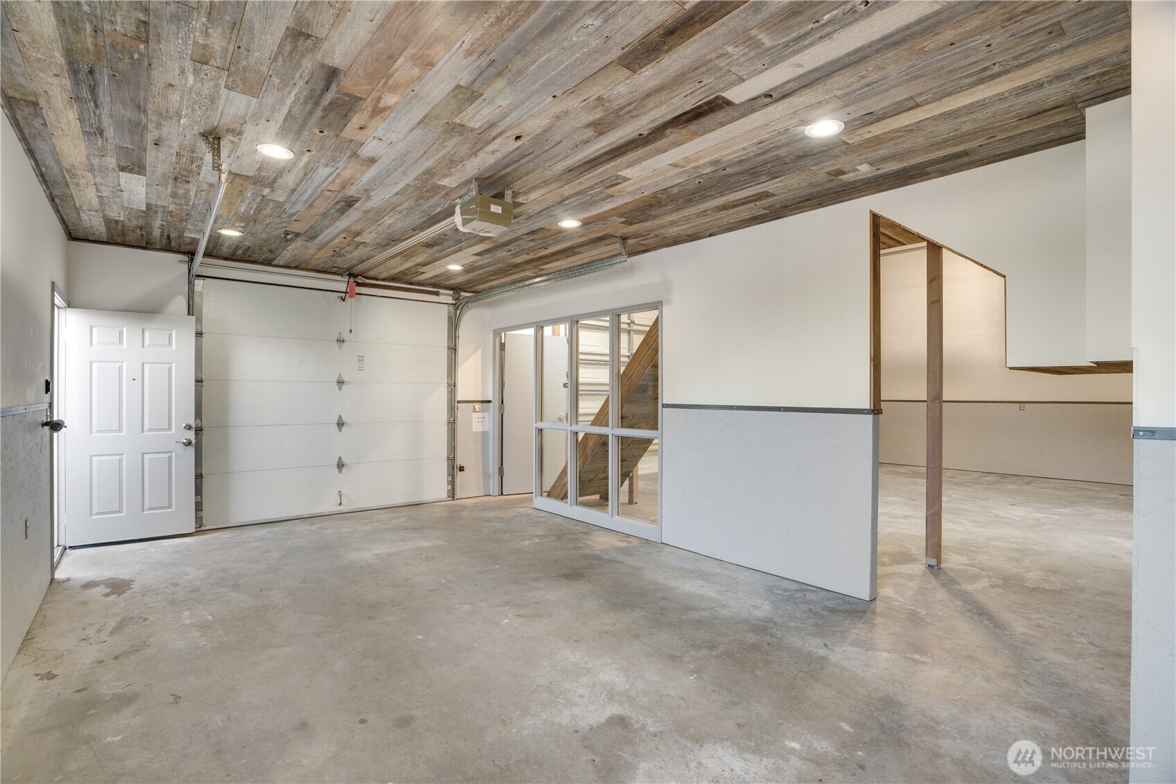 Two bays. One clean room. Staircase to the loft. 1,040 square feet that work as hard as you do.