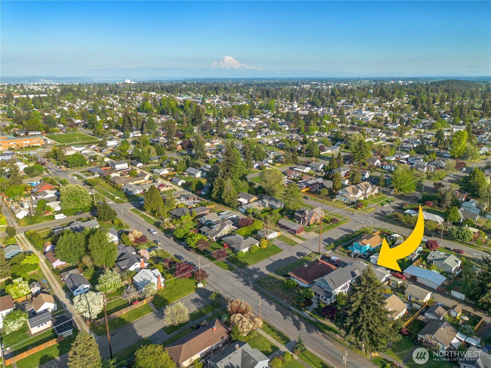 Ideally situated in a lush, tree-lined Tacoma neighborhood with iconic Mount Rainier views on the horizon — a true Pacific Northwest address.