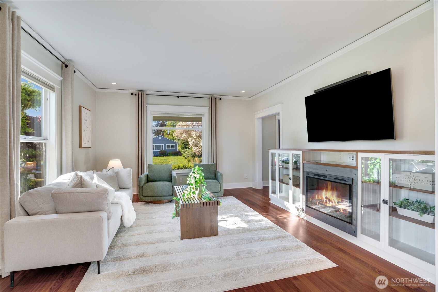 Fireplace lit, floors glowing, garden out the window — this is what 25 years of doing it right looks like.