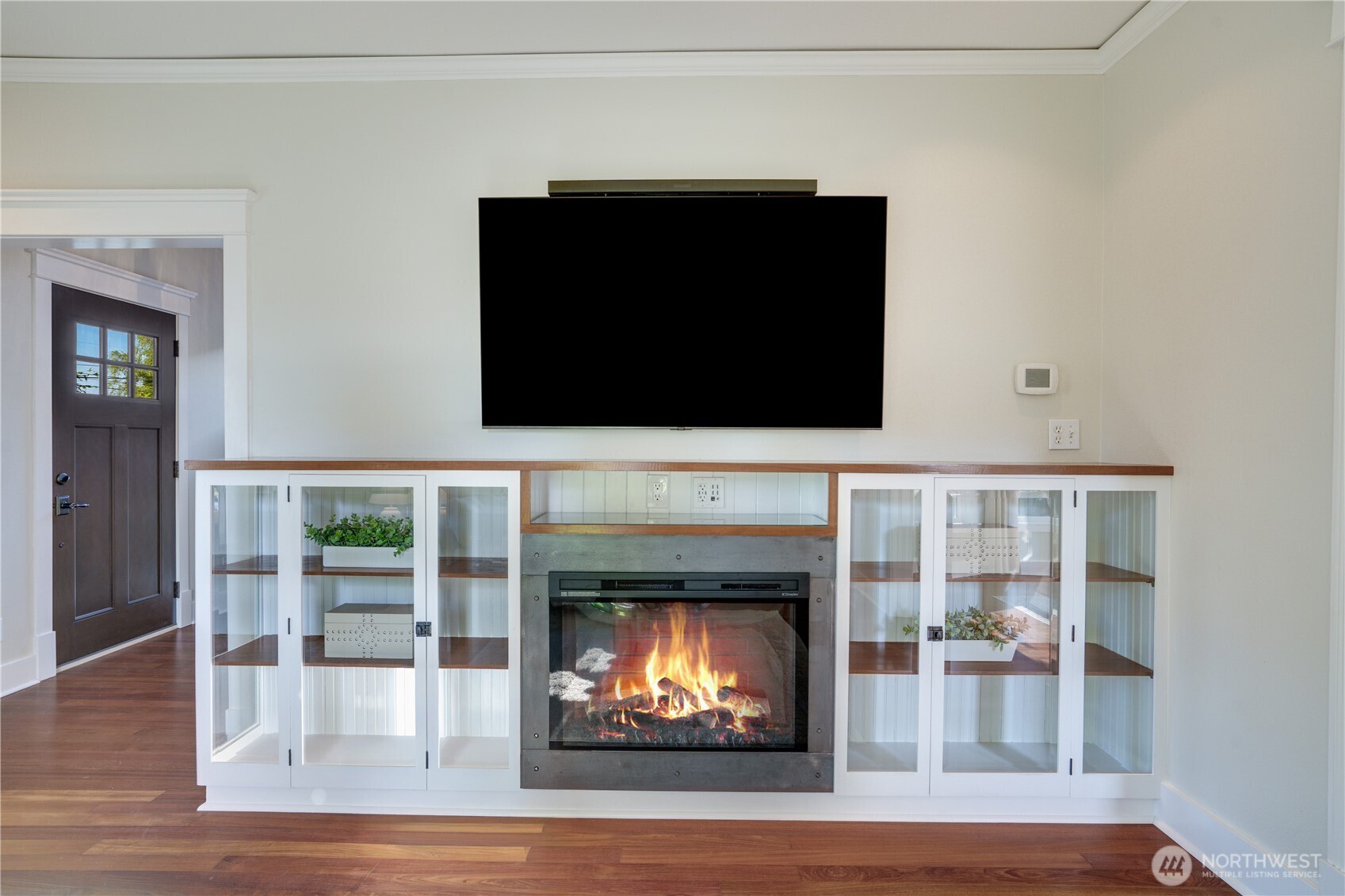 Custom built-in. Fireplace. Butcher block rail. Bob built this — it’s not from a catalog.