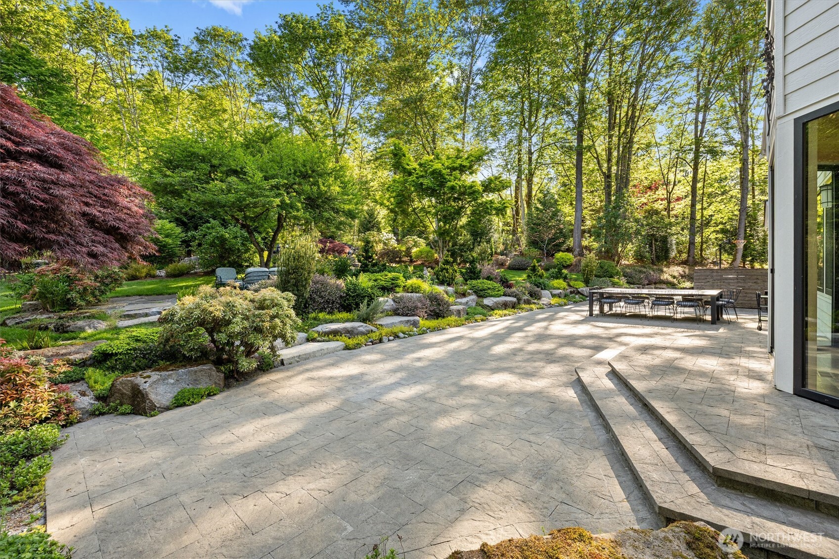 Amazing water feature is the highlight of this incredible yard. Big enough to dip your feet in on warm summer days. Runs year-round and has a newer pump and filter.