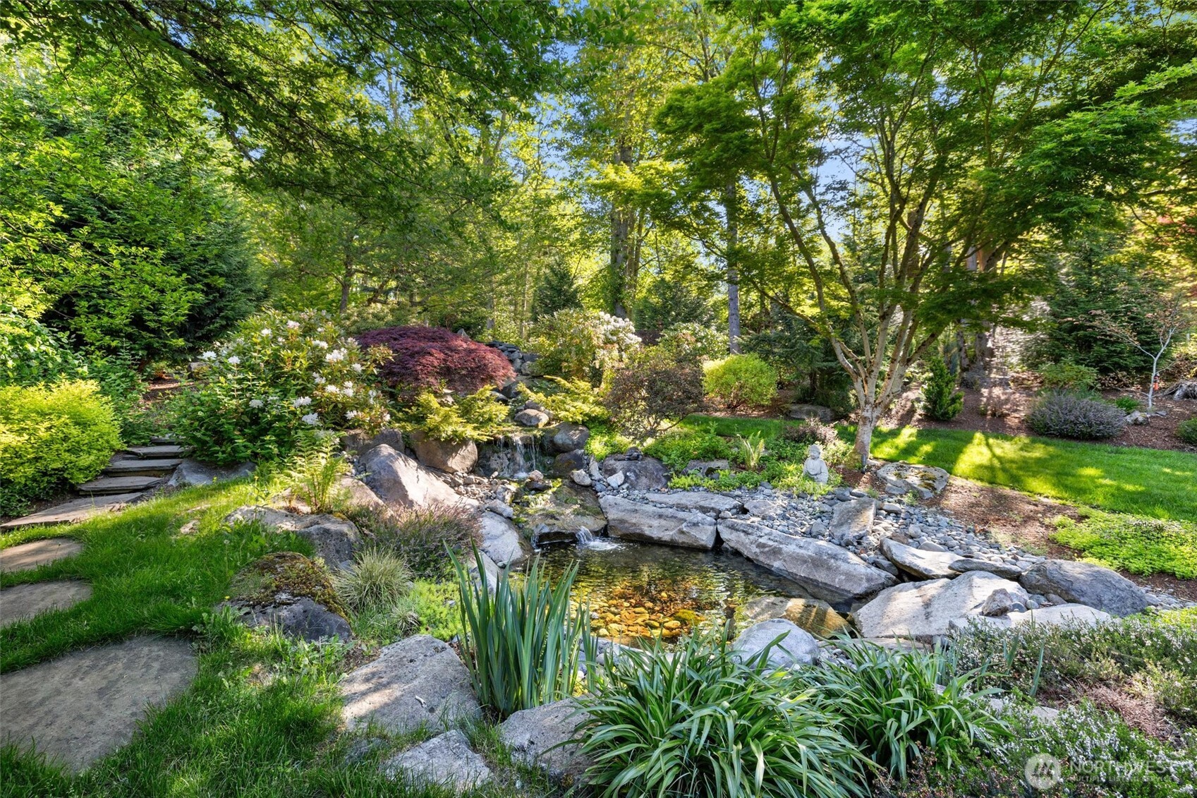 One of multiple seating and entertaining areas meandering through the backyard.
