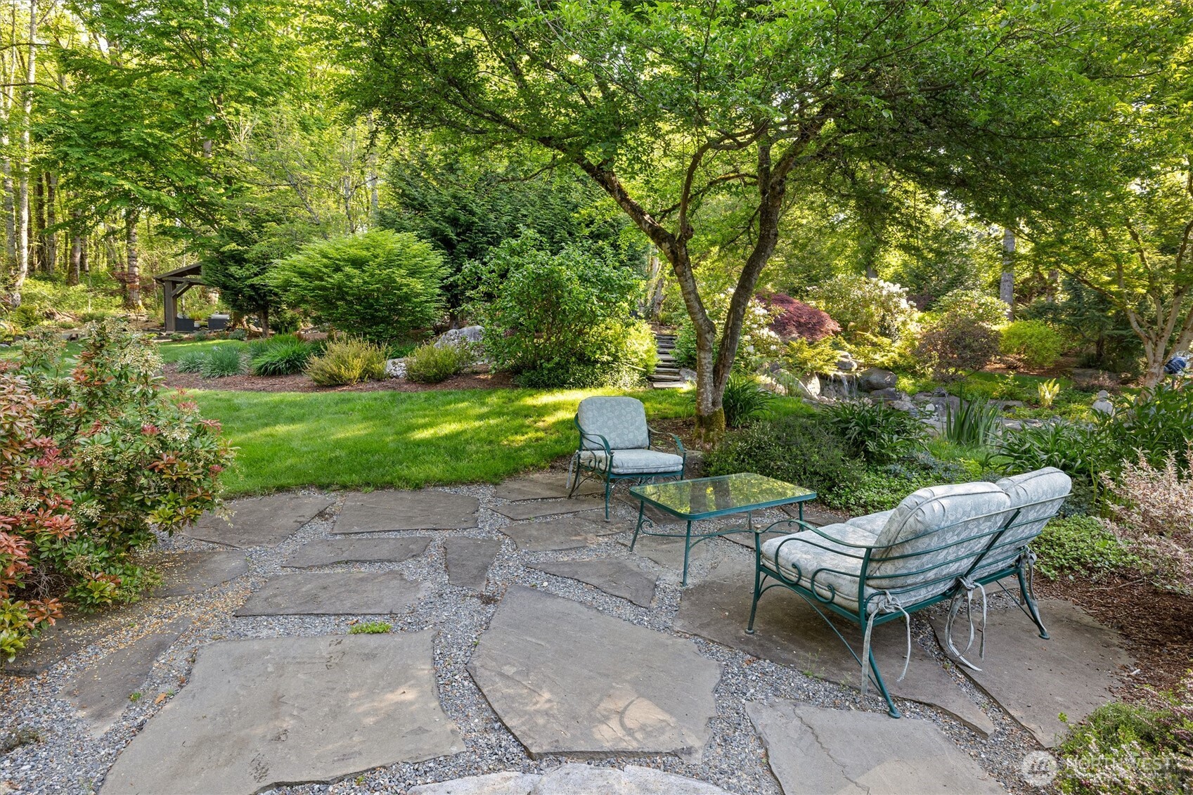 The owners are master gardeners and have transformed this property into a dream-like space. They've planted 55 native trees and plants, enhanced soil quality, built dry creeks for drainage, and more!