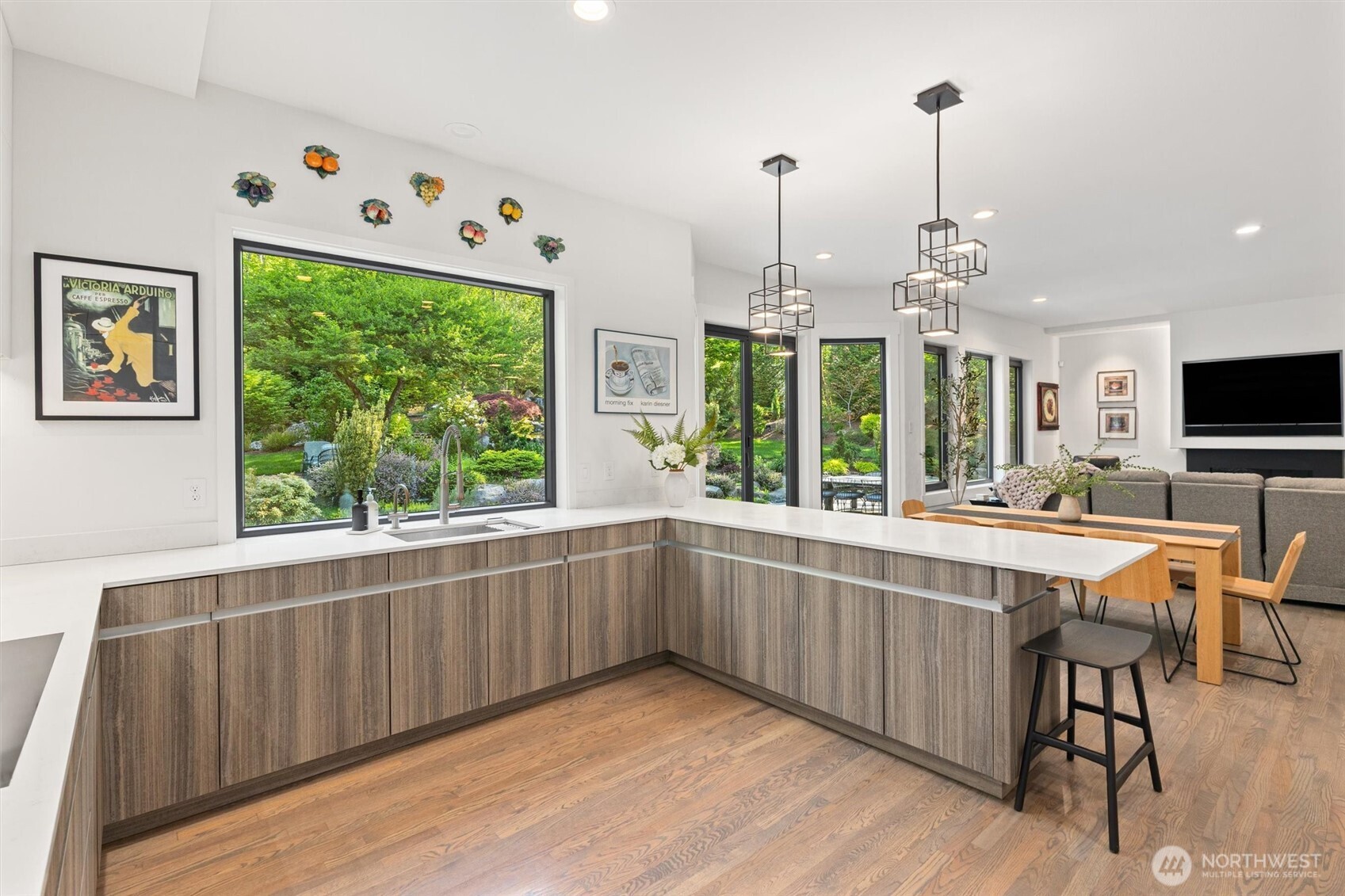 Enjoy indoor-outdoor living with this beautiful NanaWall off the second dining room. Notice the view of the water feature!