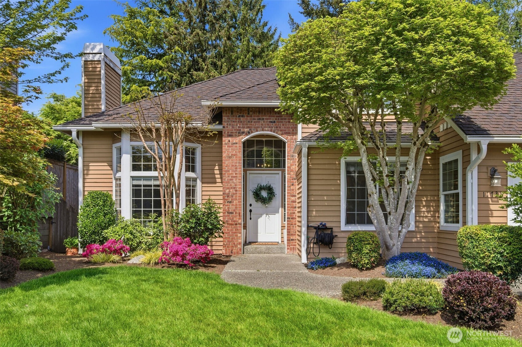 Warm, bright kitchen and dining space featuring an open layout with beautiful garden views.