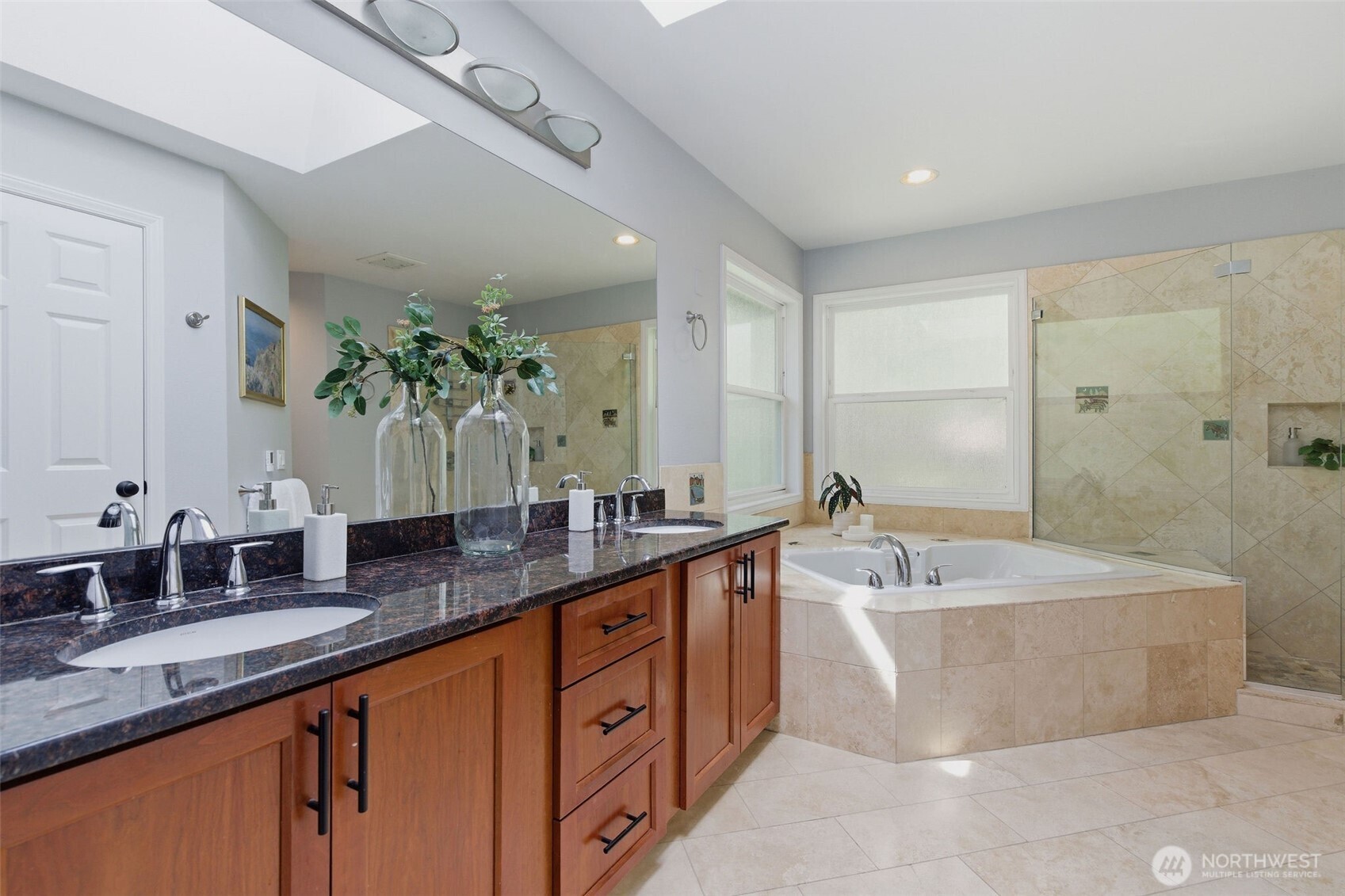 Skylight in primary bath gives natural light year-round.