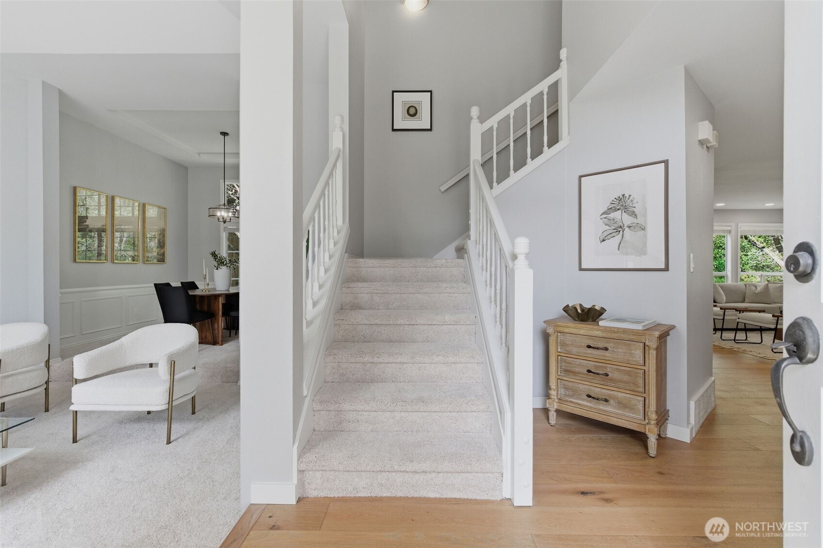 Open-concept kitchen features granite countertops, new appliances, engineered hardwood floors, pantry built-ins, and easy flow into the main living areas.
