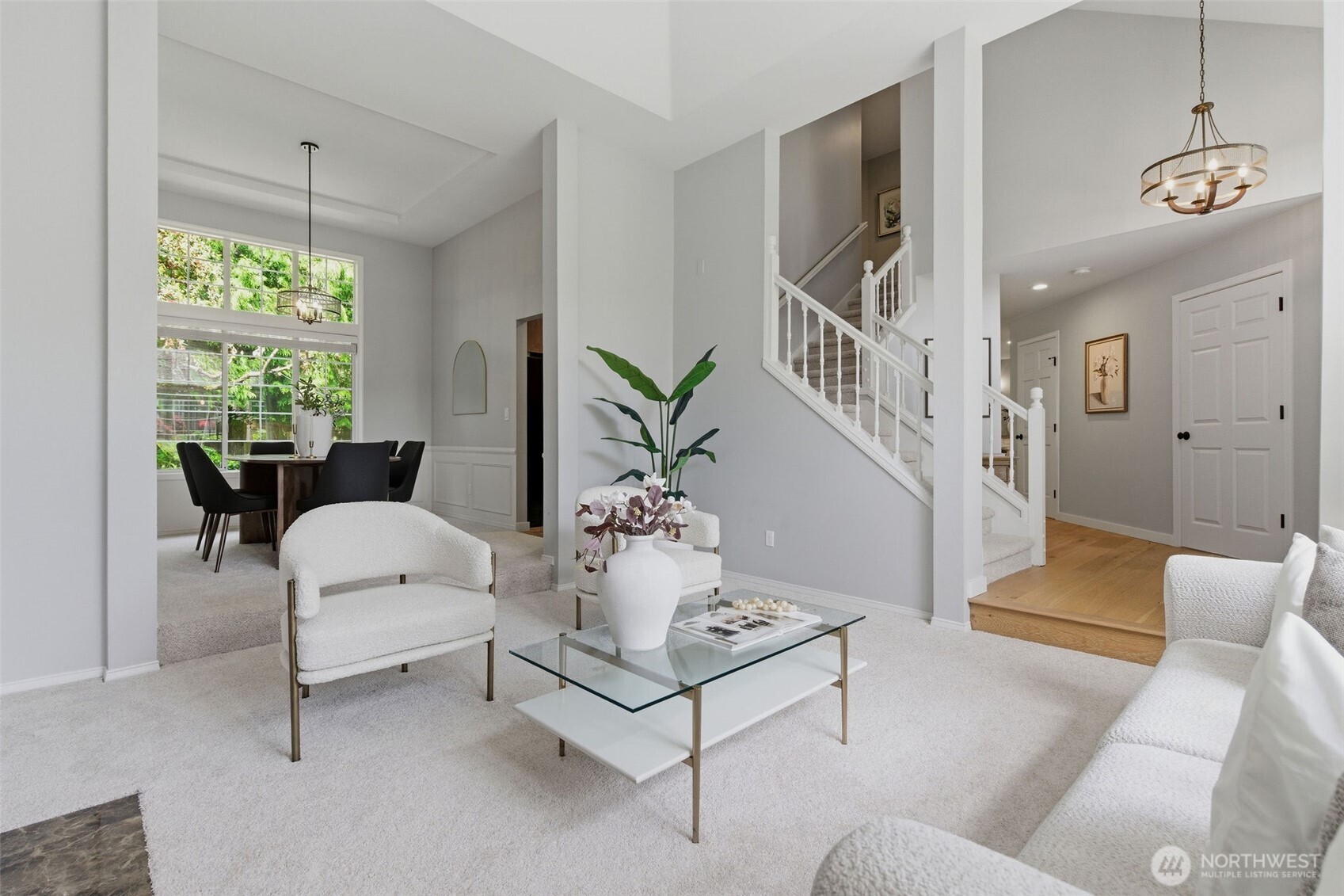 Bright family area with cozy fireplace looks onto manicured yard and patio with view of retention pond that offers privacy!