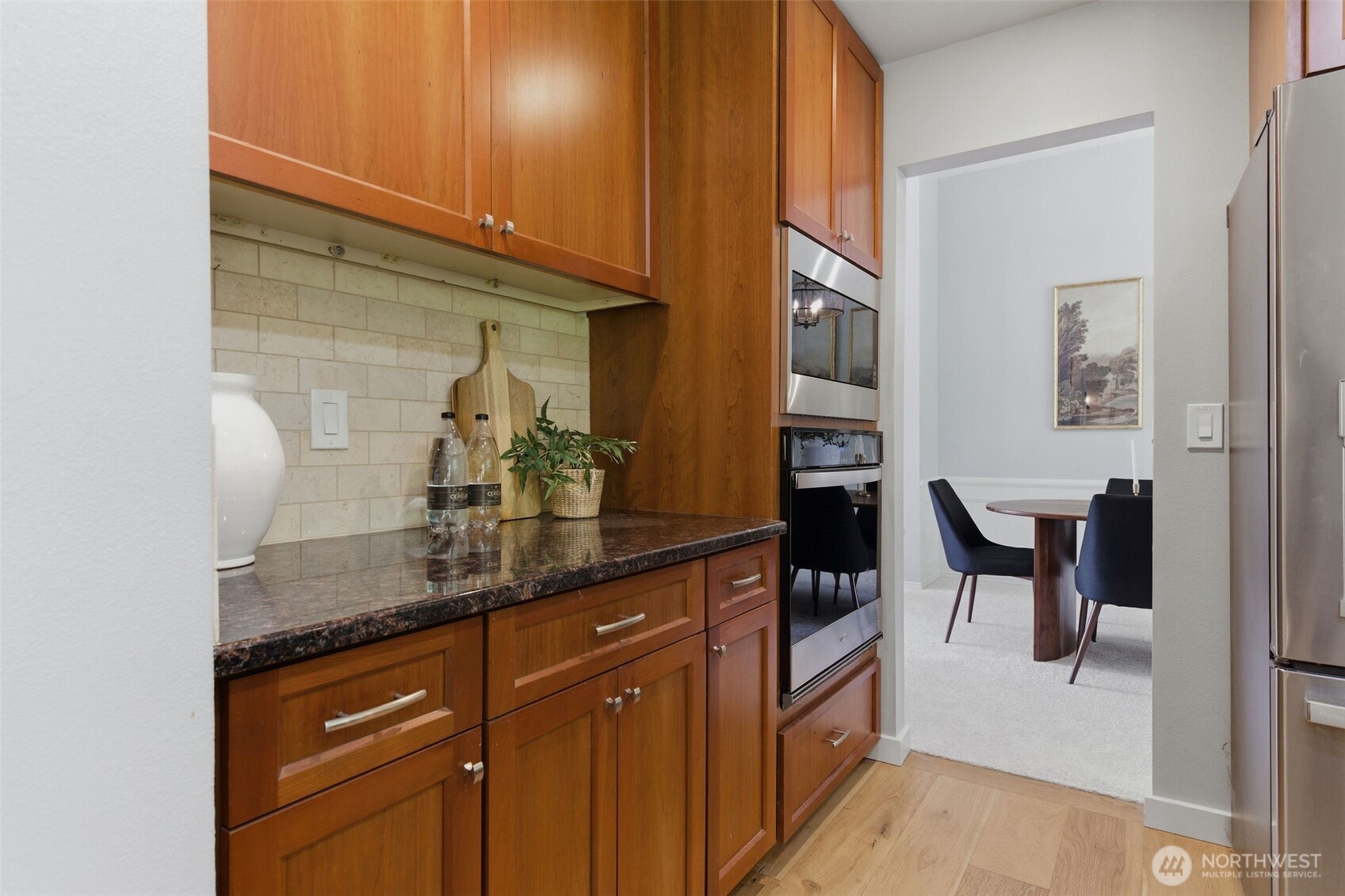 Modern finishes throughout! Barn door is darling way to keep garage entrance private.