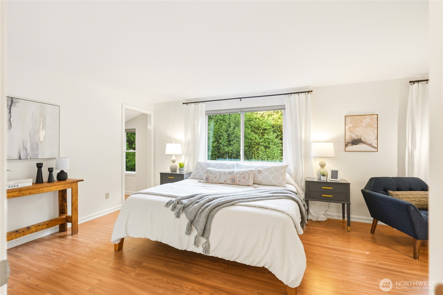 The primary bedroom features exquisite nature views and a large walk-in closet.