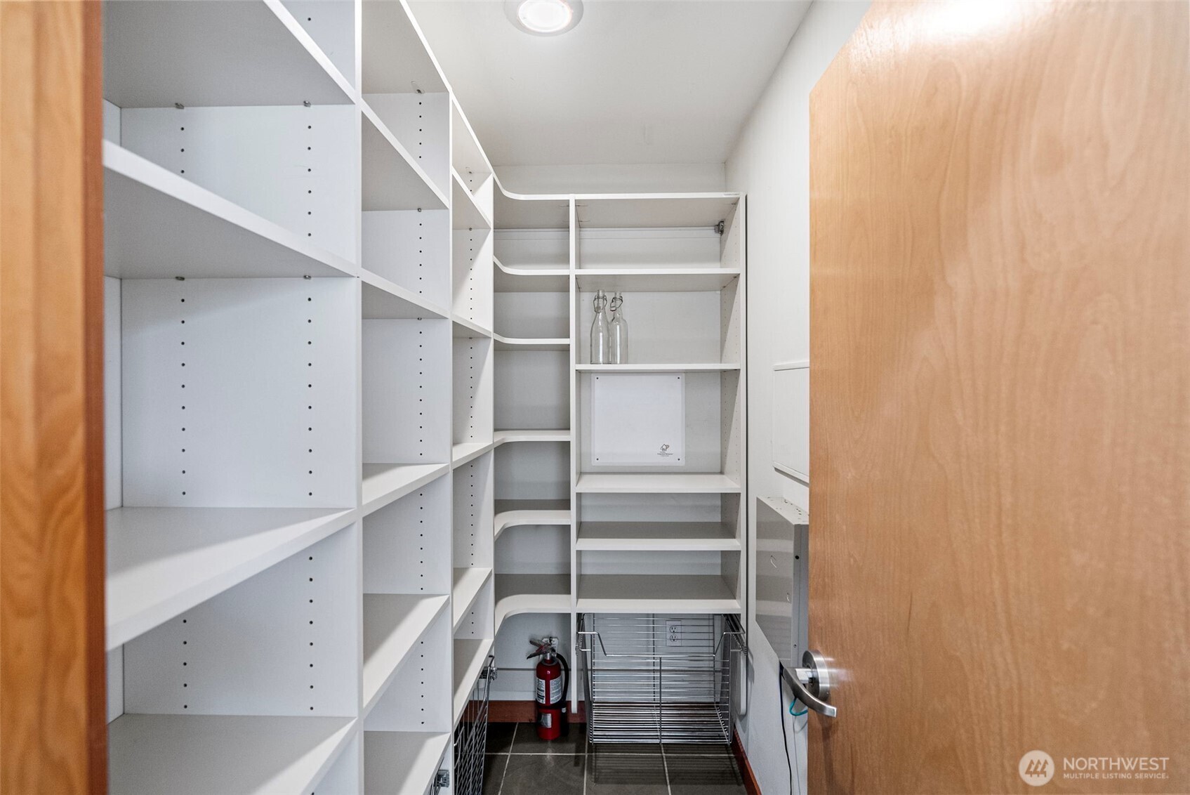 Additional pantry could be converted into a half bath or home office