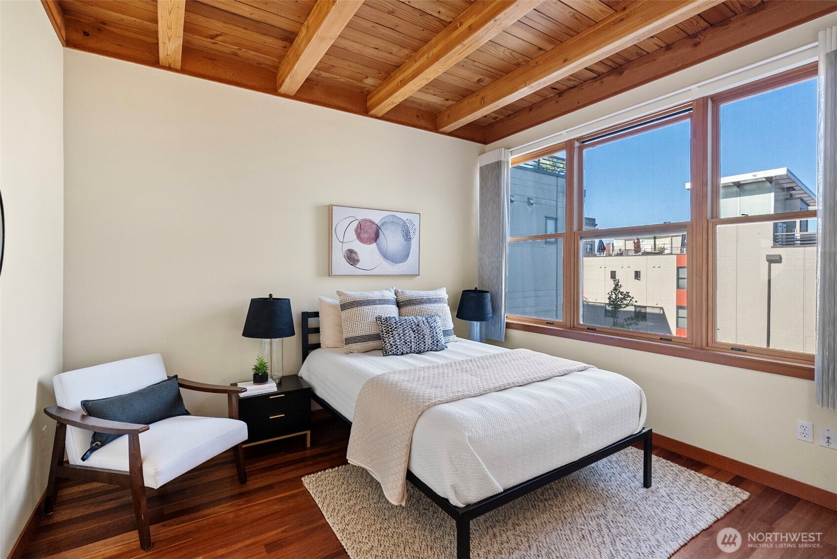 Primary bedroom with exposed wood ceiling