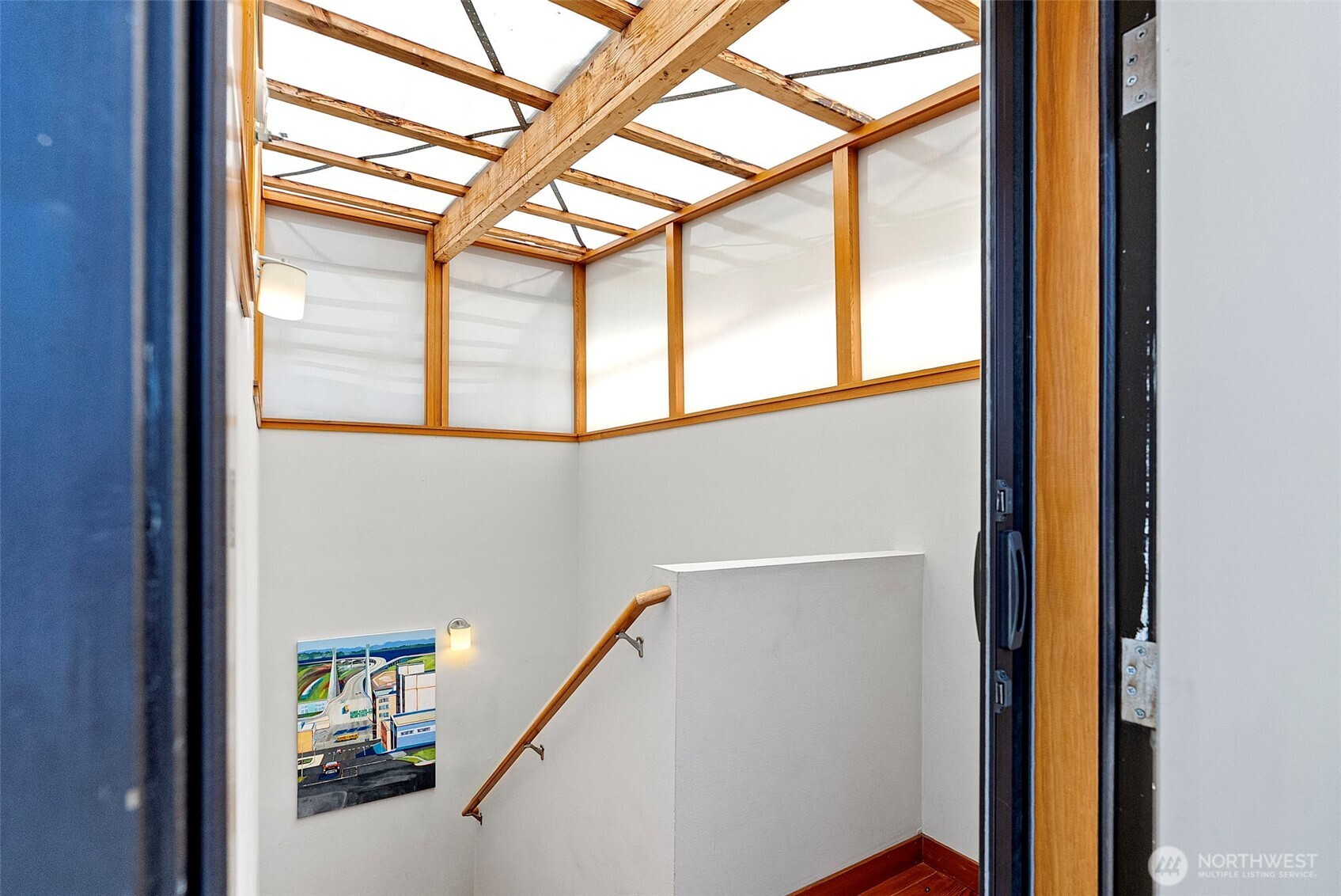 Upper stairwell opens to the rooftop deck