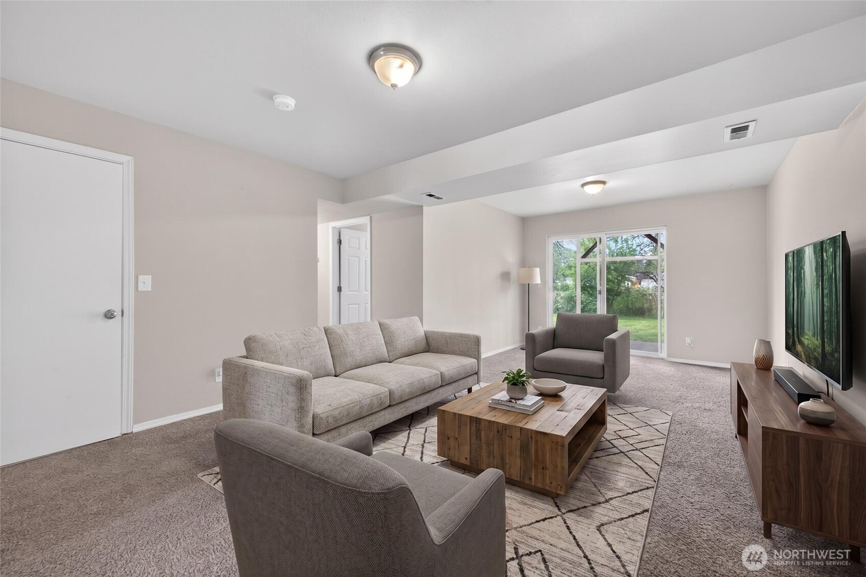 Another view of vitually staged lower level bonus room for guests or possible rental