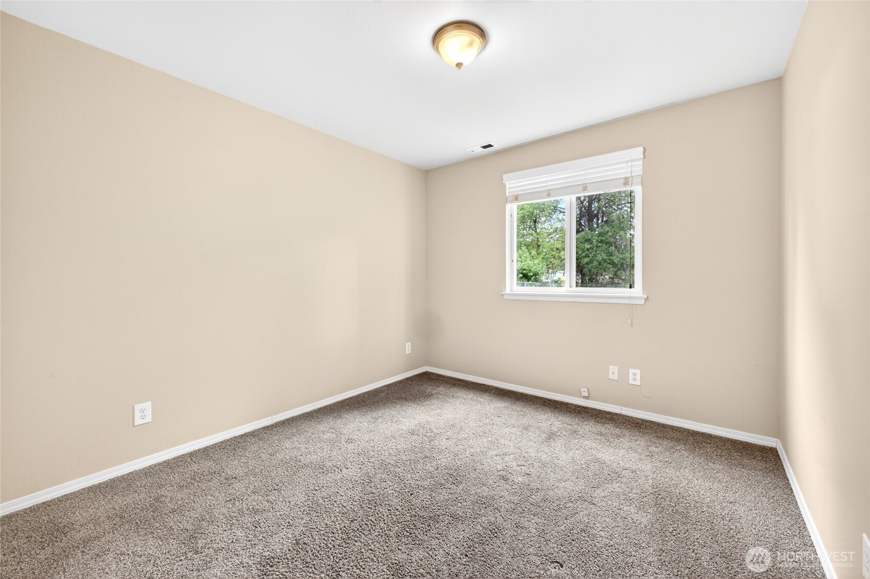 Lower level bedroom view with window looking out to back yard