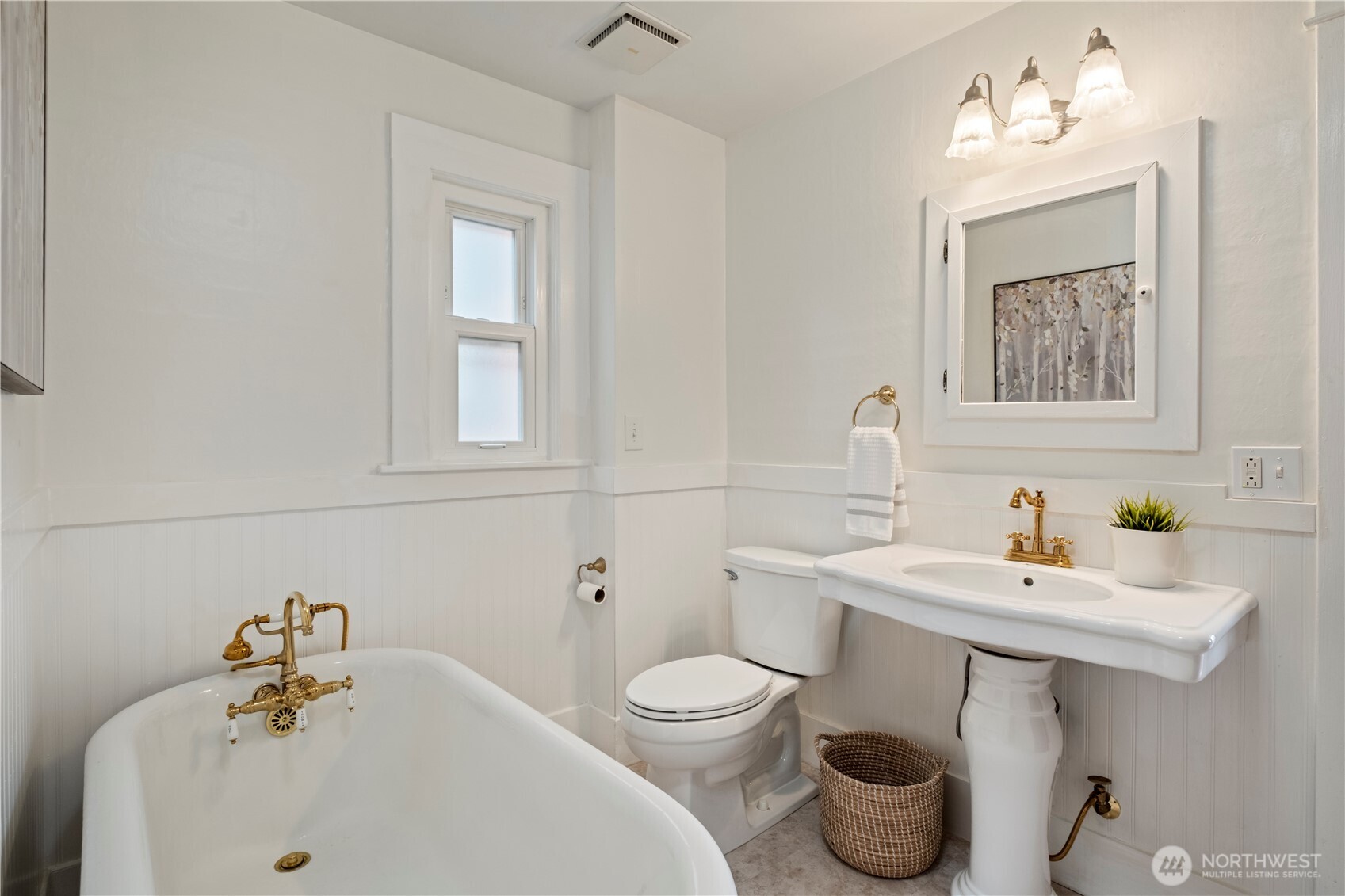 Updated main floor bathroom with vintage charm and a clawfoot tub