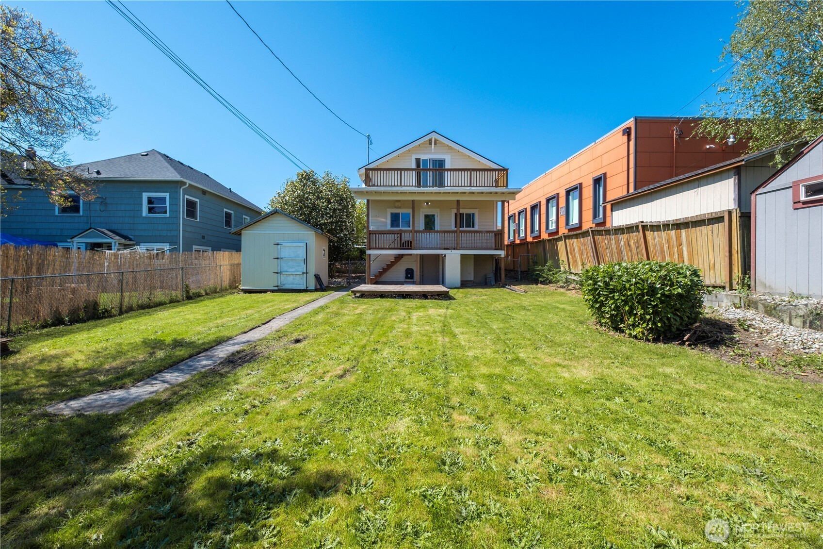 Expansive back yard with a shed for storage