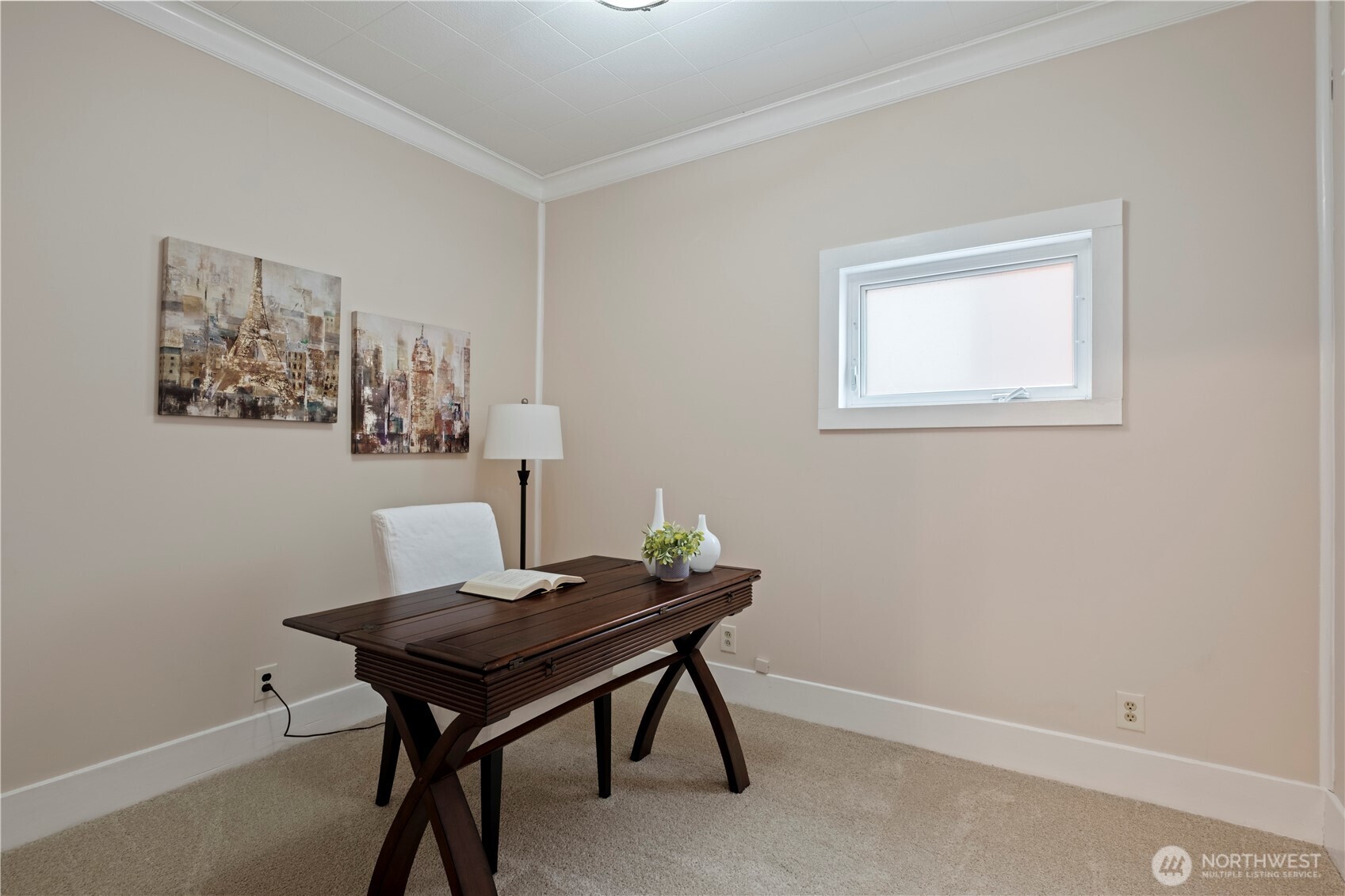 Office, bedroom, library? Right off the dining room and with fresh carpet