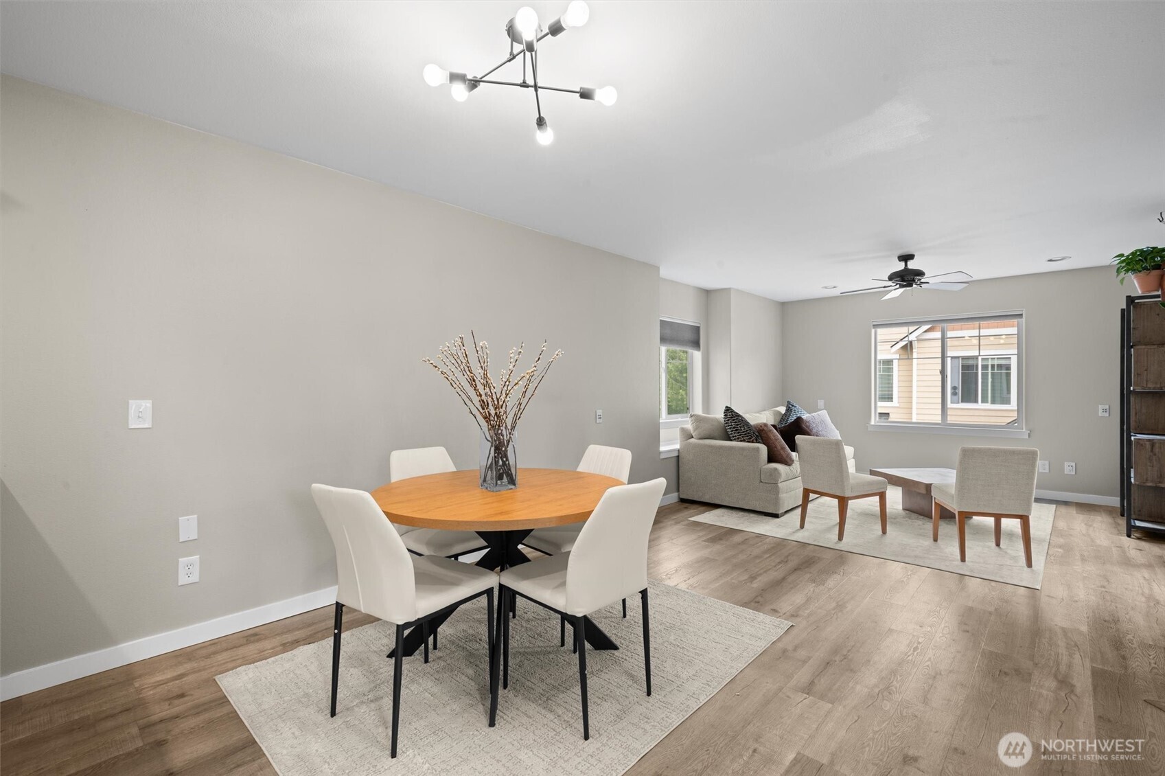The dining room is spacious and offers updated lighting.